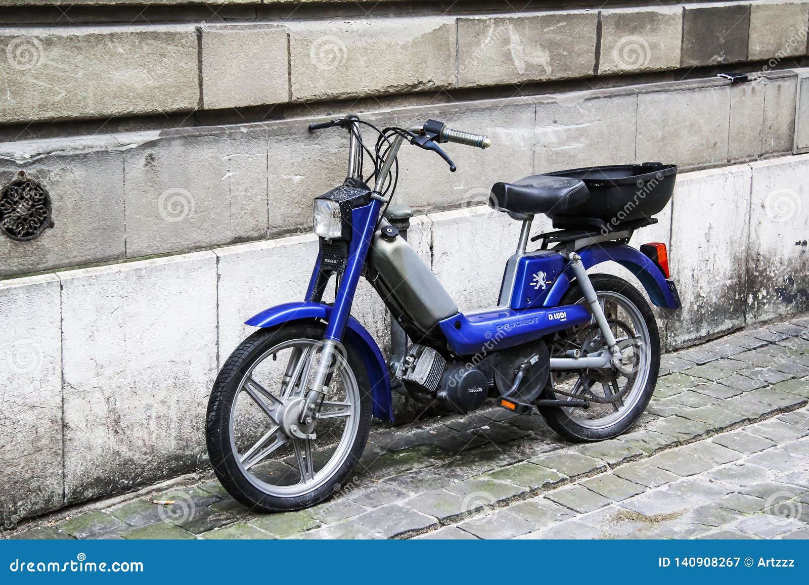 peugeot 103 sp chooper and mbk 51 motobecane caferacer french vintage retro  moped in style custom and racing parked in city street Photos