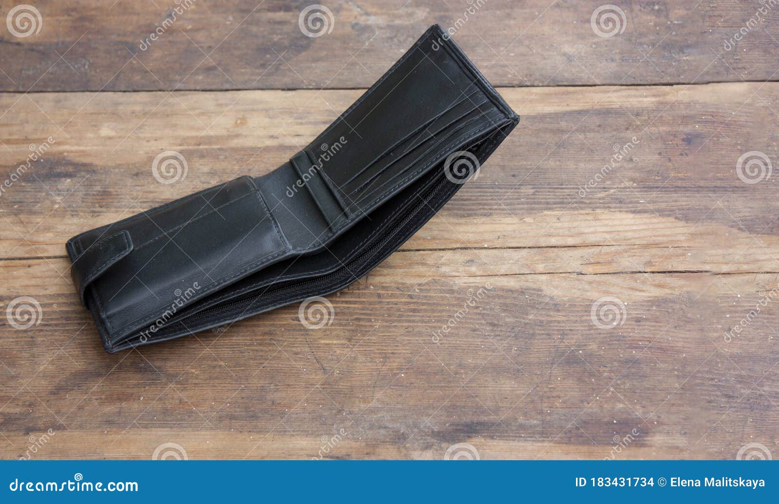 A Genuine Leather Wallet is Lying Empty on an Old Wooden Table. Concept ...