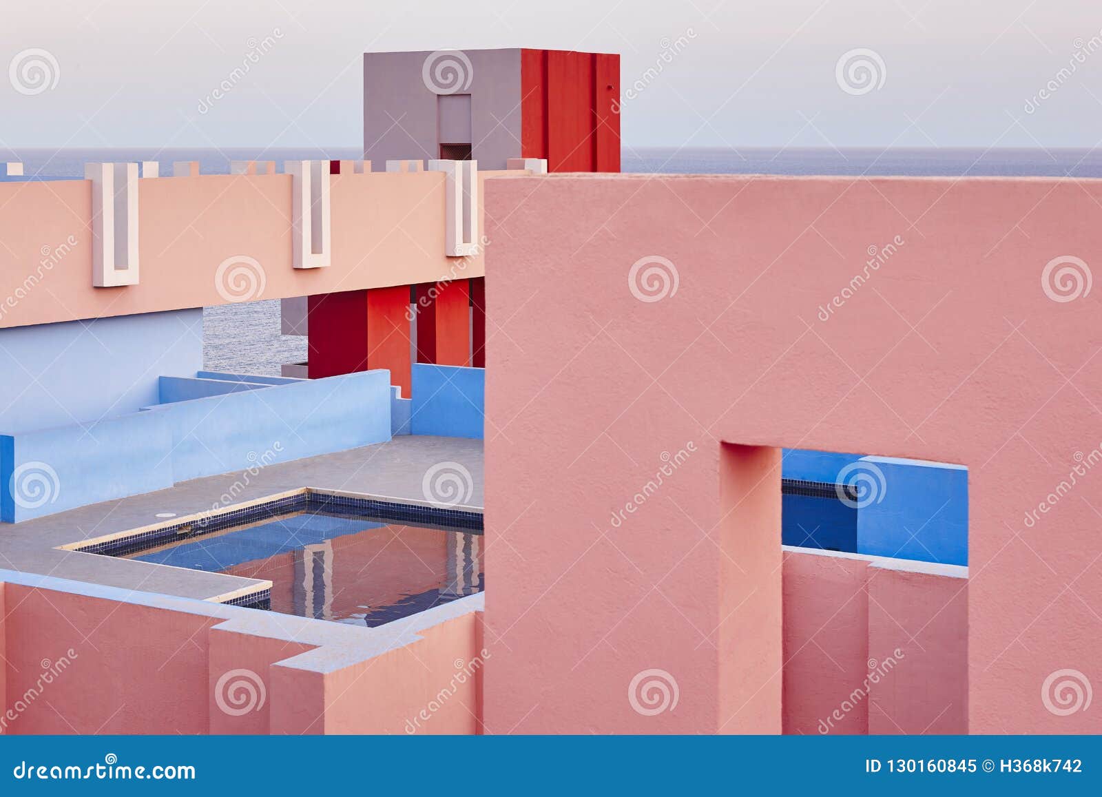 geometric building swimming pool. red wall, la manzanera. calpe