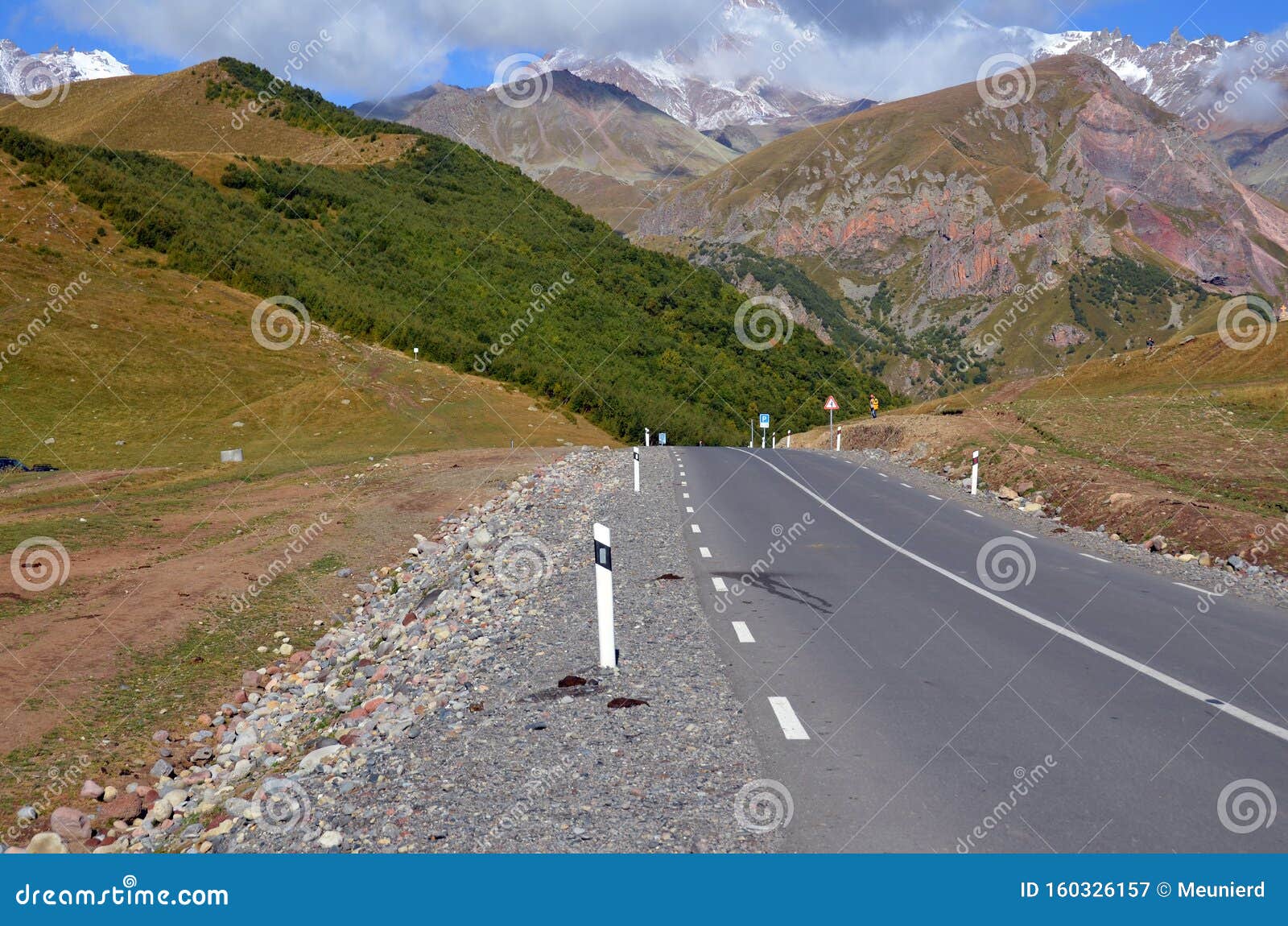 georgia caucasus mountain landscape during a sunny day. mount kazbek is a dormant stratovolcano and one of the major mountains of