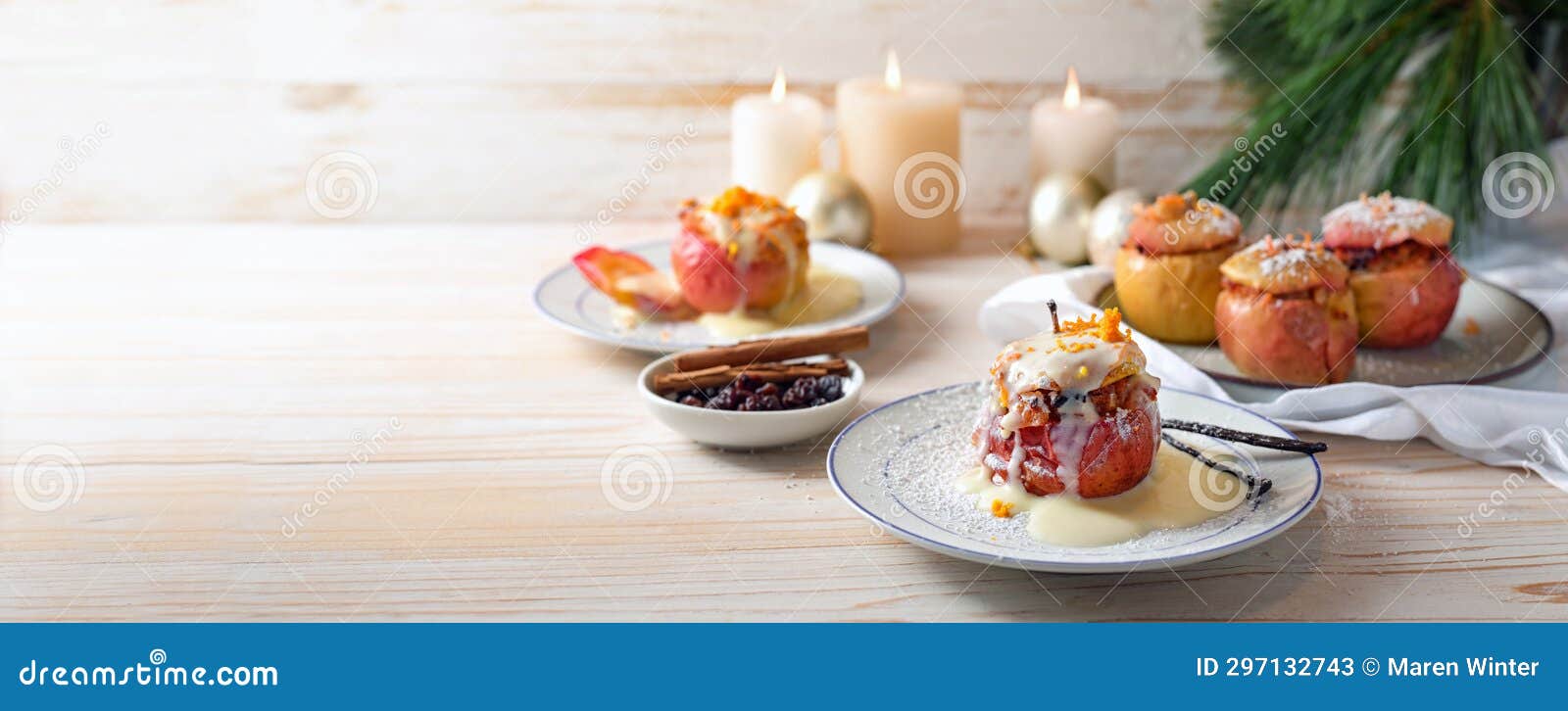 german baked apples wit powdered sugar and vanilla sauce, stuffed with almonds, honey and rosins on a light wooden background,