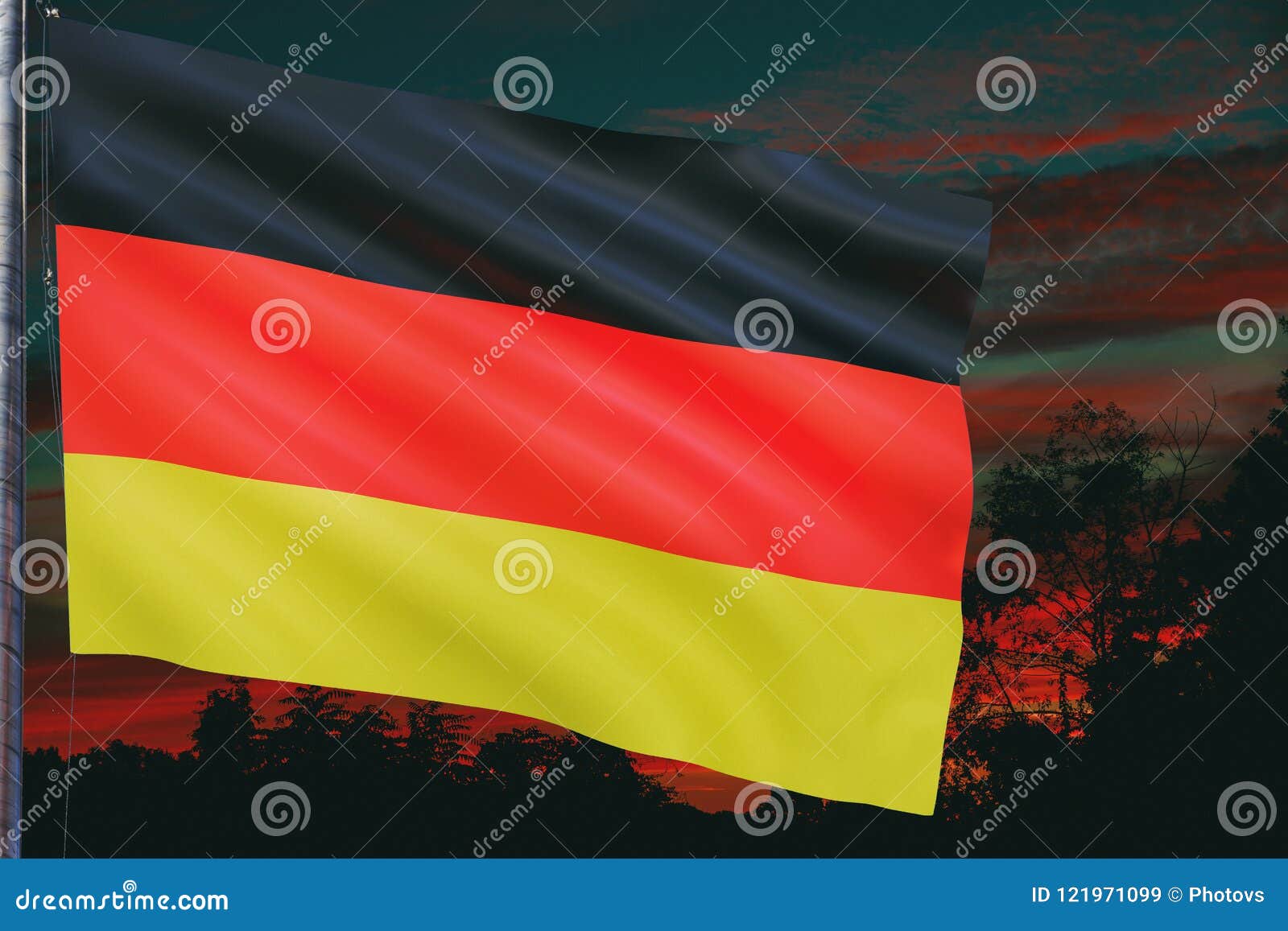 german national flag waving during the evening sunset
