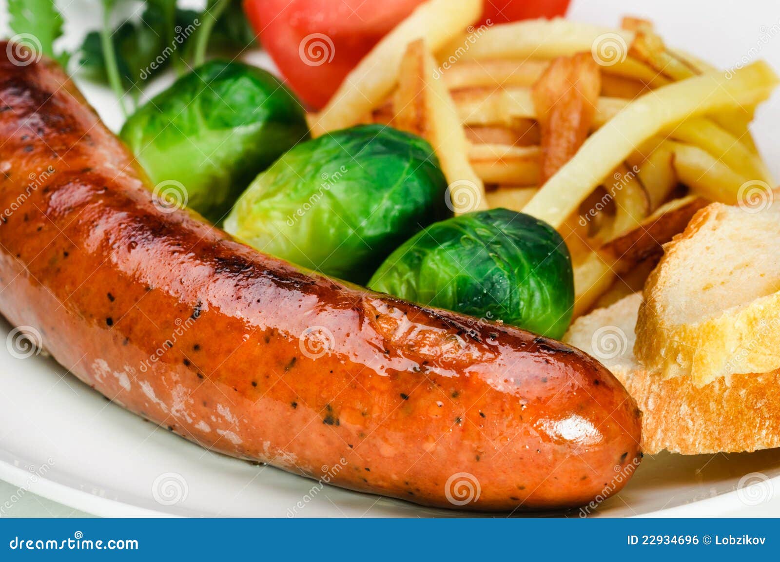 German Sausage with Potatoes and Vegetables. Stock Photo Image of
