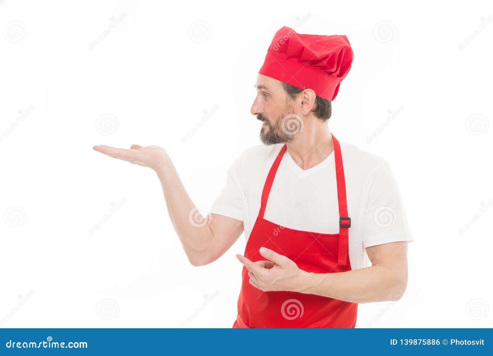 Gesturing Aside Mature Chief Cook In Red Cooking Apron Senior Cook With Beard And Moustache 