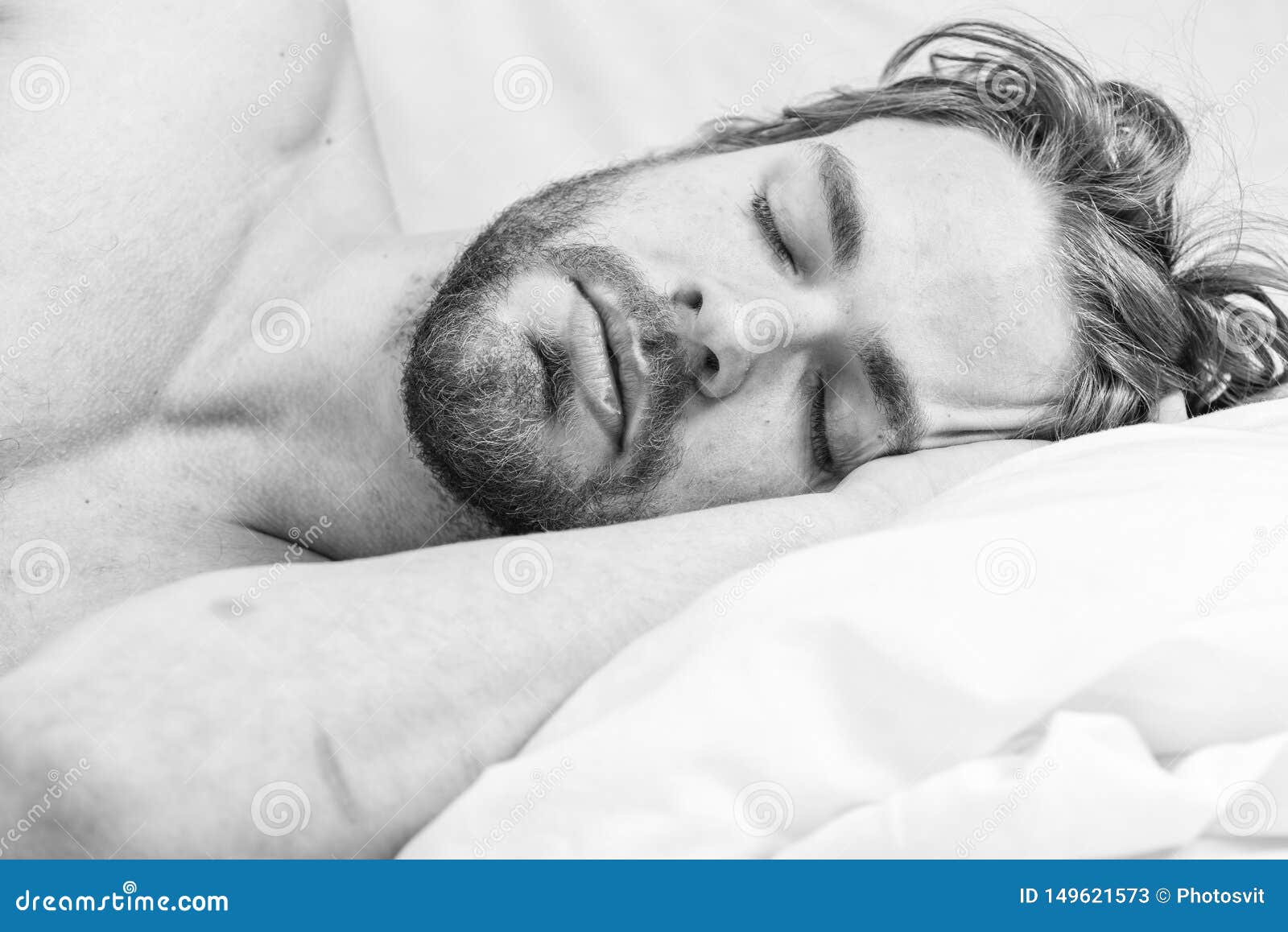 get adequate and consistent amount of sleep every night. how much sleep you actually need. bearded man sleeping face