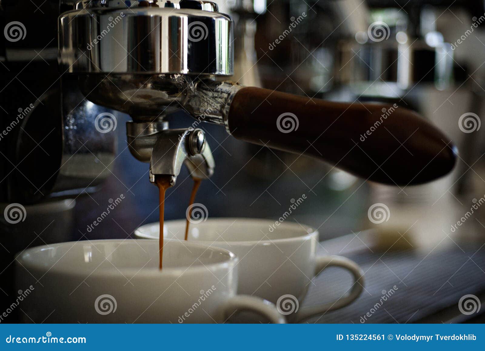 getting your perfect drink. coffee being brewed in coffeehouse or cafe. coffee cups. small cups to serve hot coffee