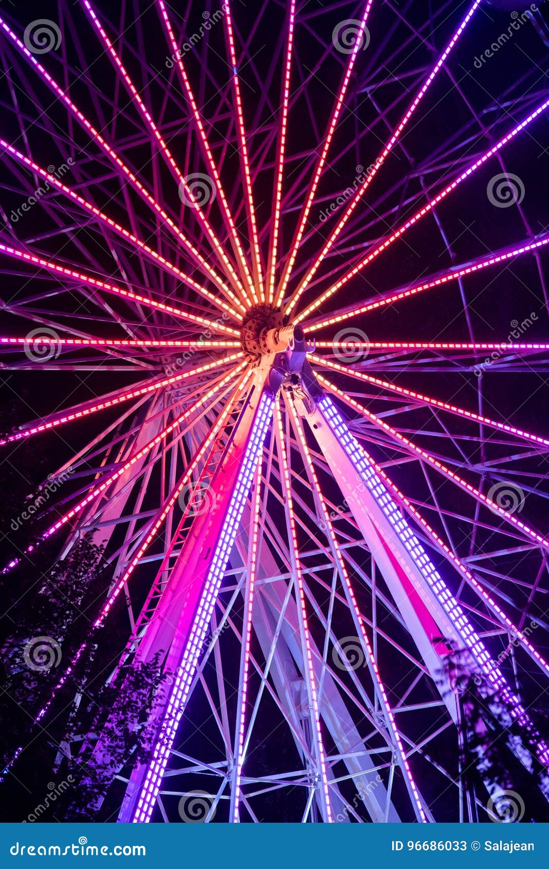 BONTIDA, ROMANIA - JULY 14, 2017: People of Electric Castle festival enjoying a ride at night on the Giant ferris wheel