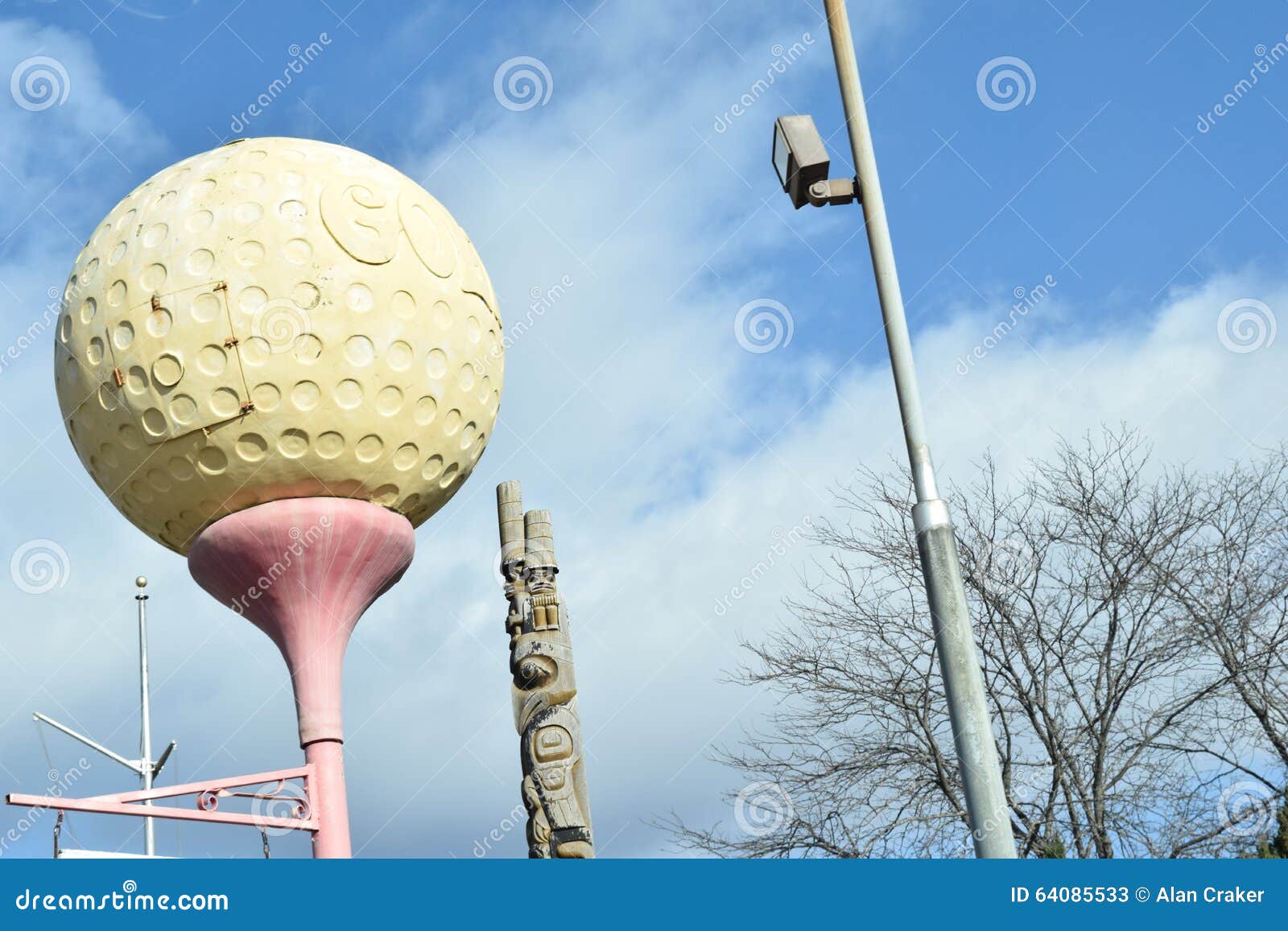 Giant Golf Ball Shaped Sign on Street Post Editorial Stock Photo