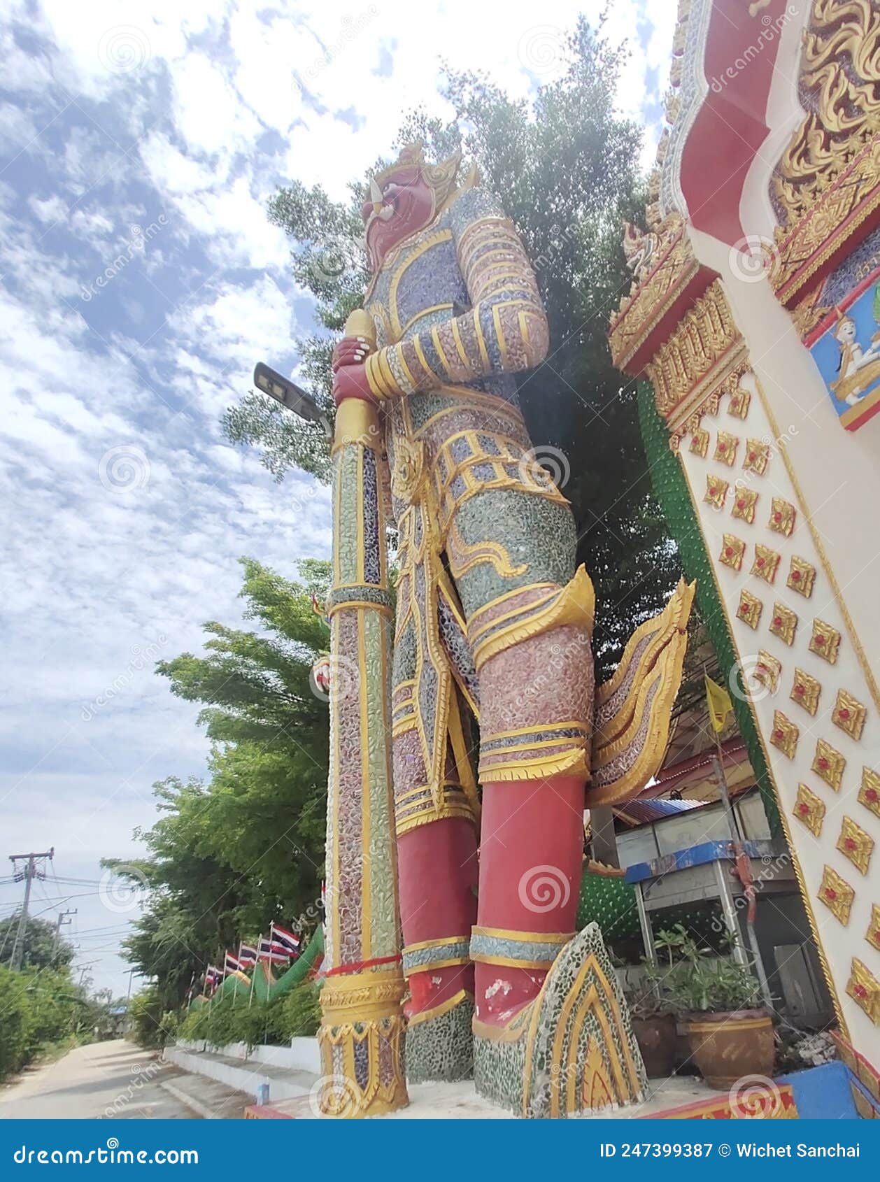 A Giant Statue Stands Holding a Cylinder in Front of the Entrance. Stock Image Image of