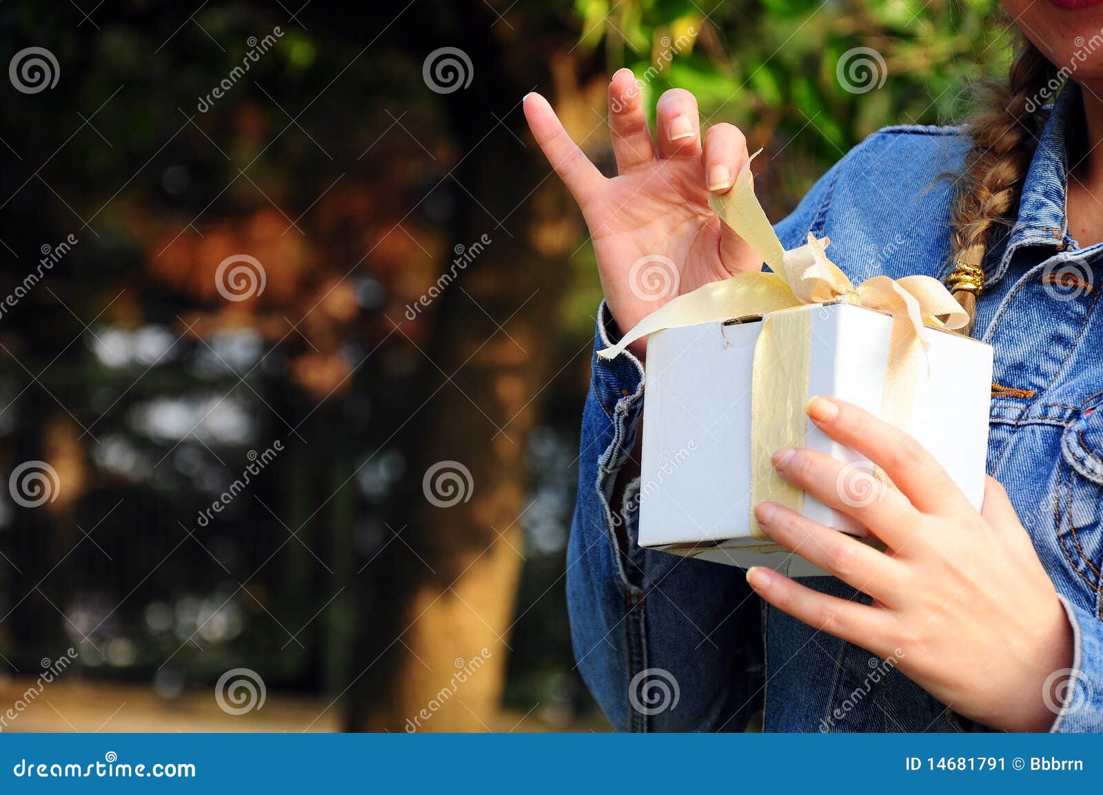 Gift box. A woman opens her gift