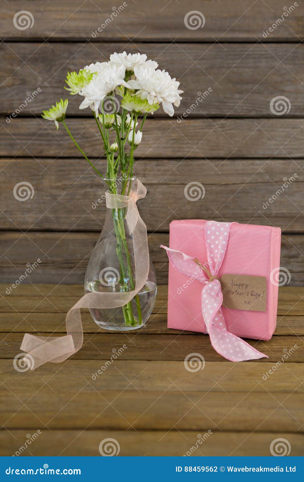 Gift Box and Flower Vase on Wooden Surface Stock Photo Image of event