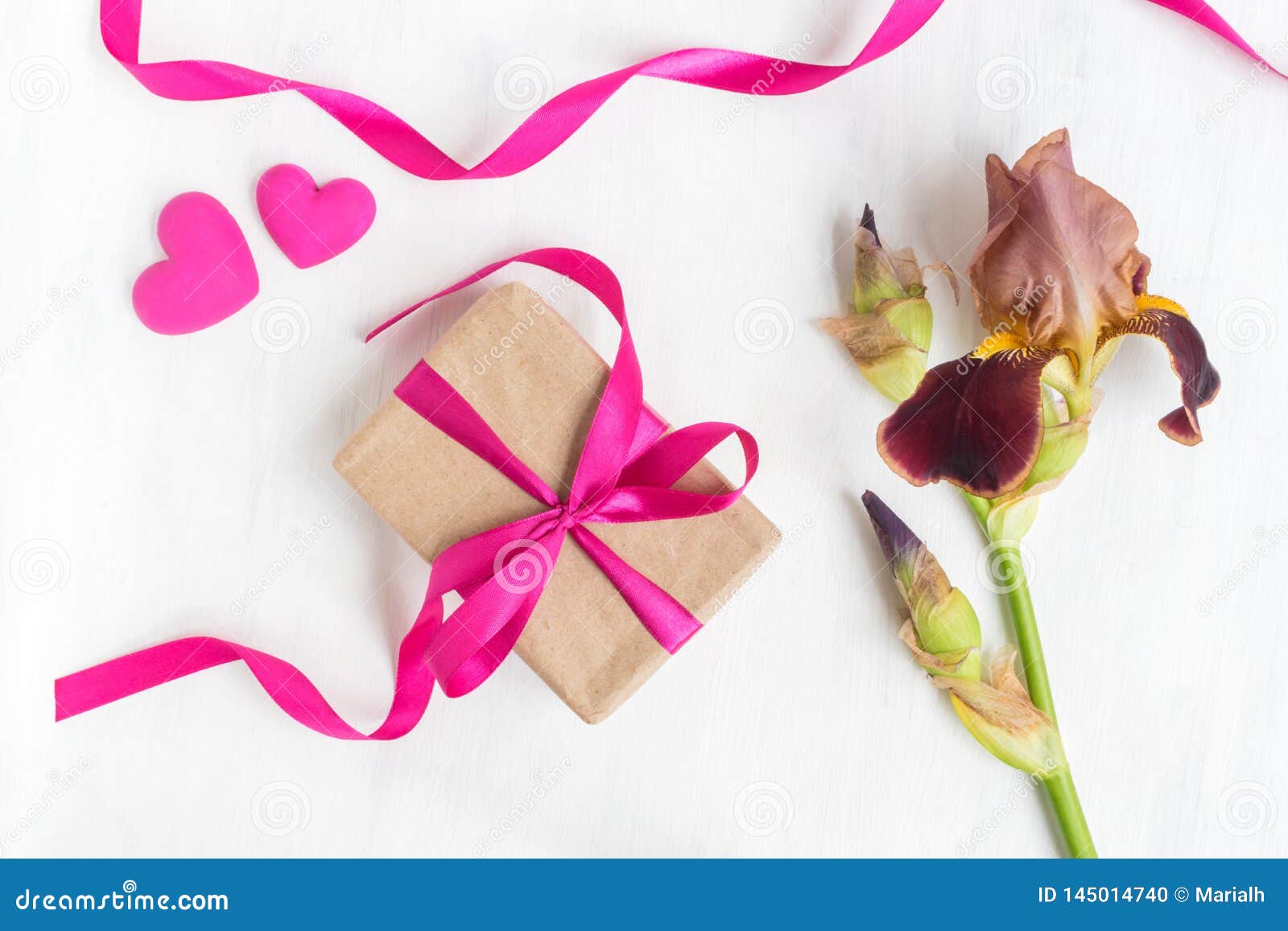 Gift box with iris flower stock photo. Image of invitation 145014740