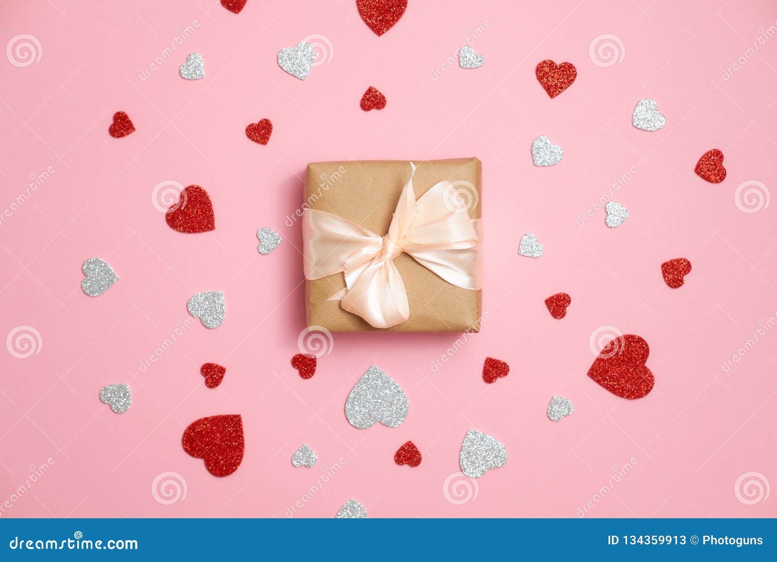 Gift Box Packed in Kraft Paper with Ribbon Bow and Red and Grey Heart ...