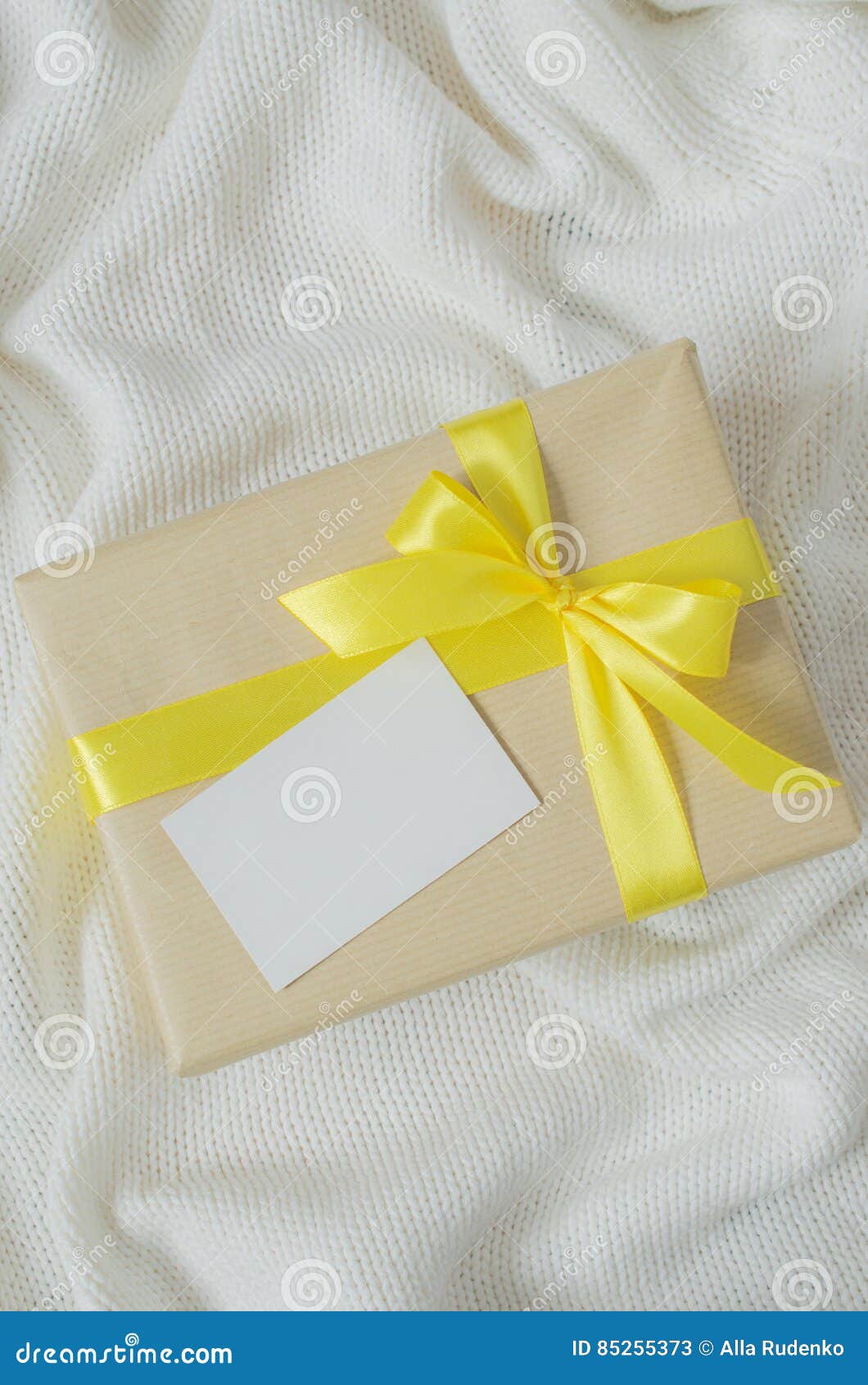 Gift Box. Present with Empty Postcard on Knitted Blanket Background