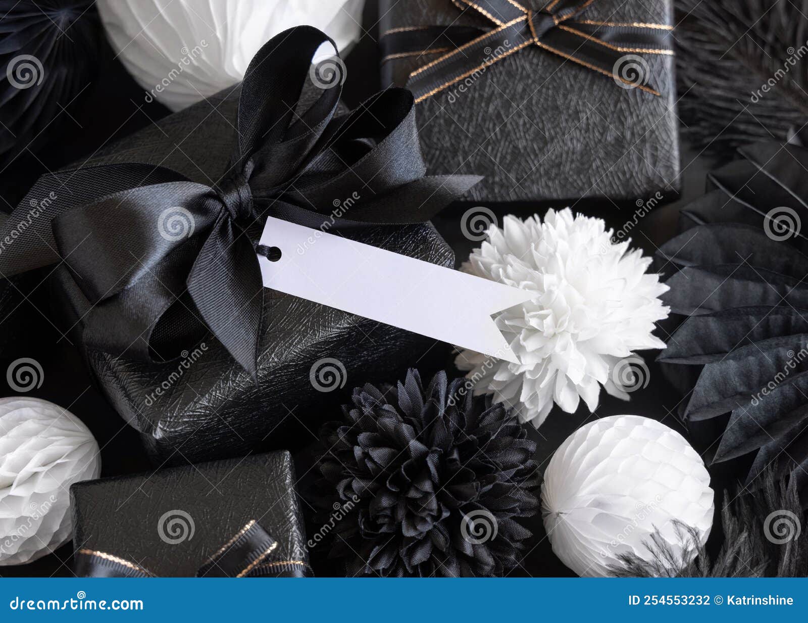 Gift Boxes with Black and White Paper Flowers and Decorations, Horizontal Gift Tag Mockup Stock