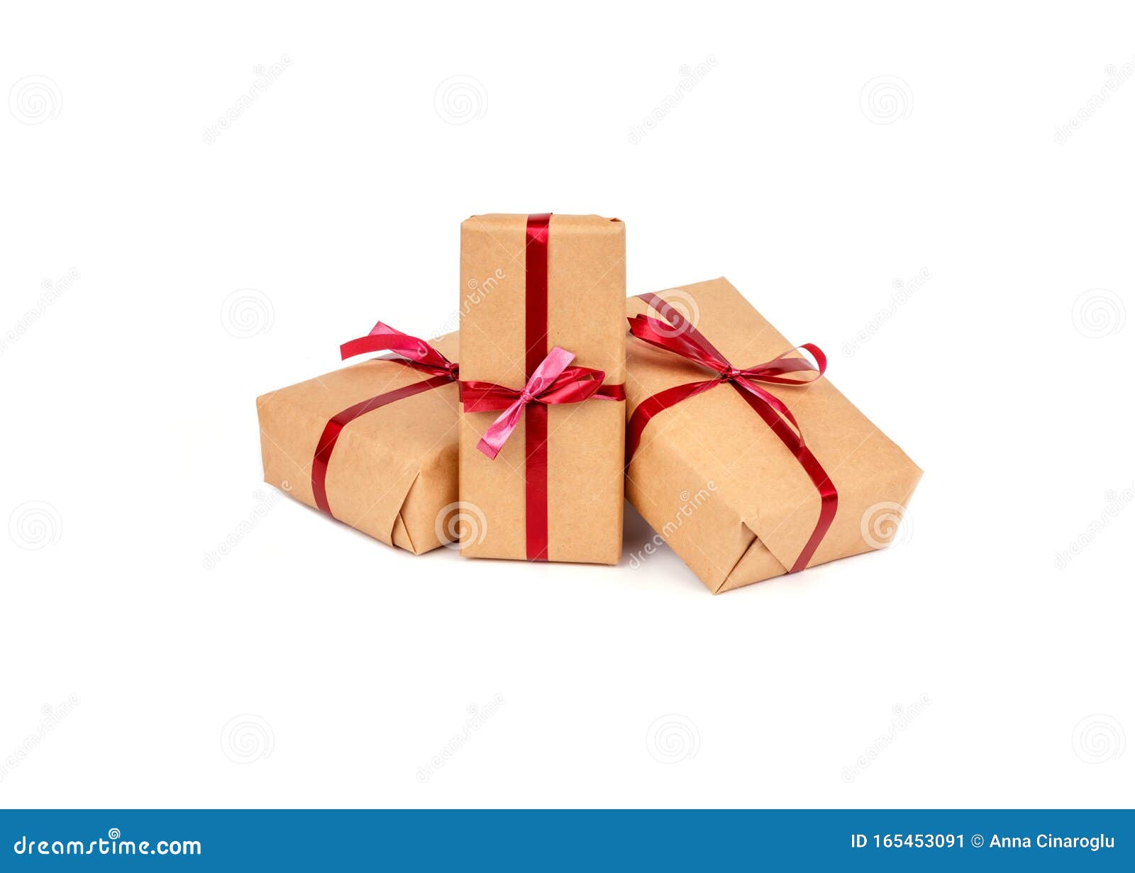 Gift Boxes in Craft Wrapping Paper with Red Ribbons Isolated Stock