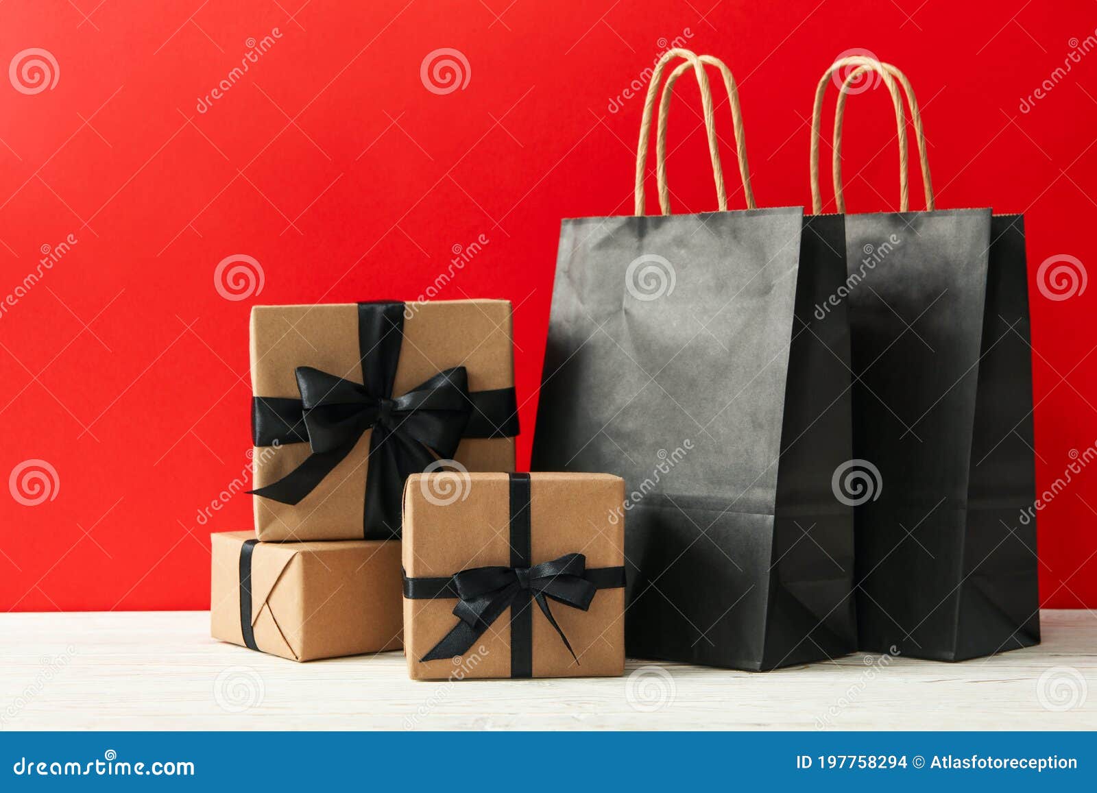 Gift Boxes and Paper Bags Against Red Background Stock Photo Image of