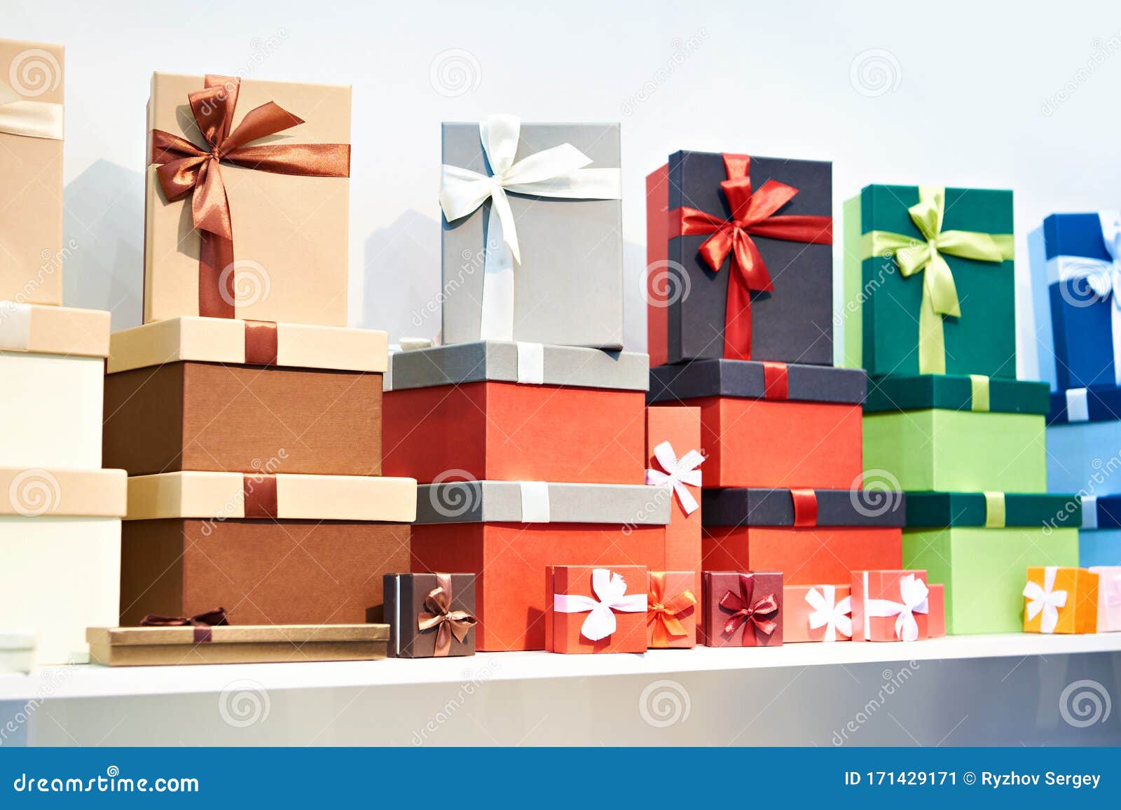 Gift boxes on store shelf stock image. Image of gold 171429171