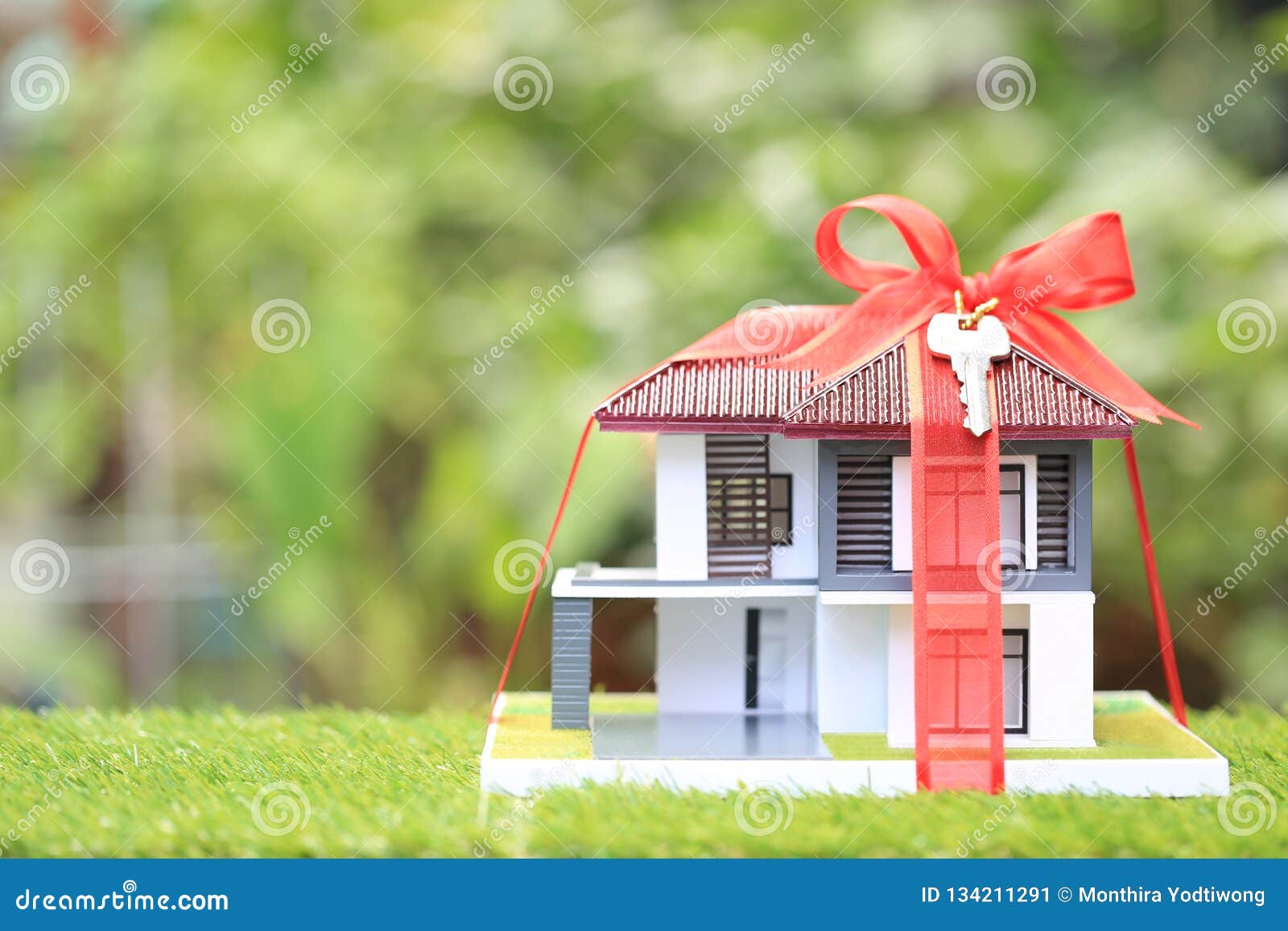Gift New Home and Real Estate Concept,Model House with Red Ribbon on  Natural Green Background Stock Image - Image of invest, home: 134211291