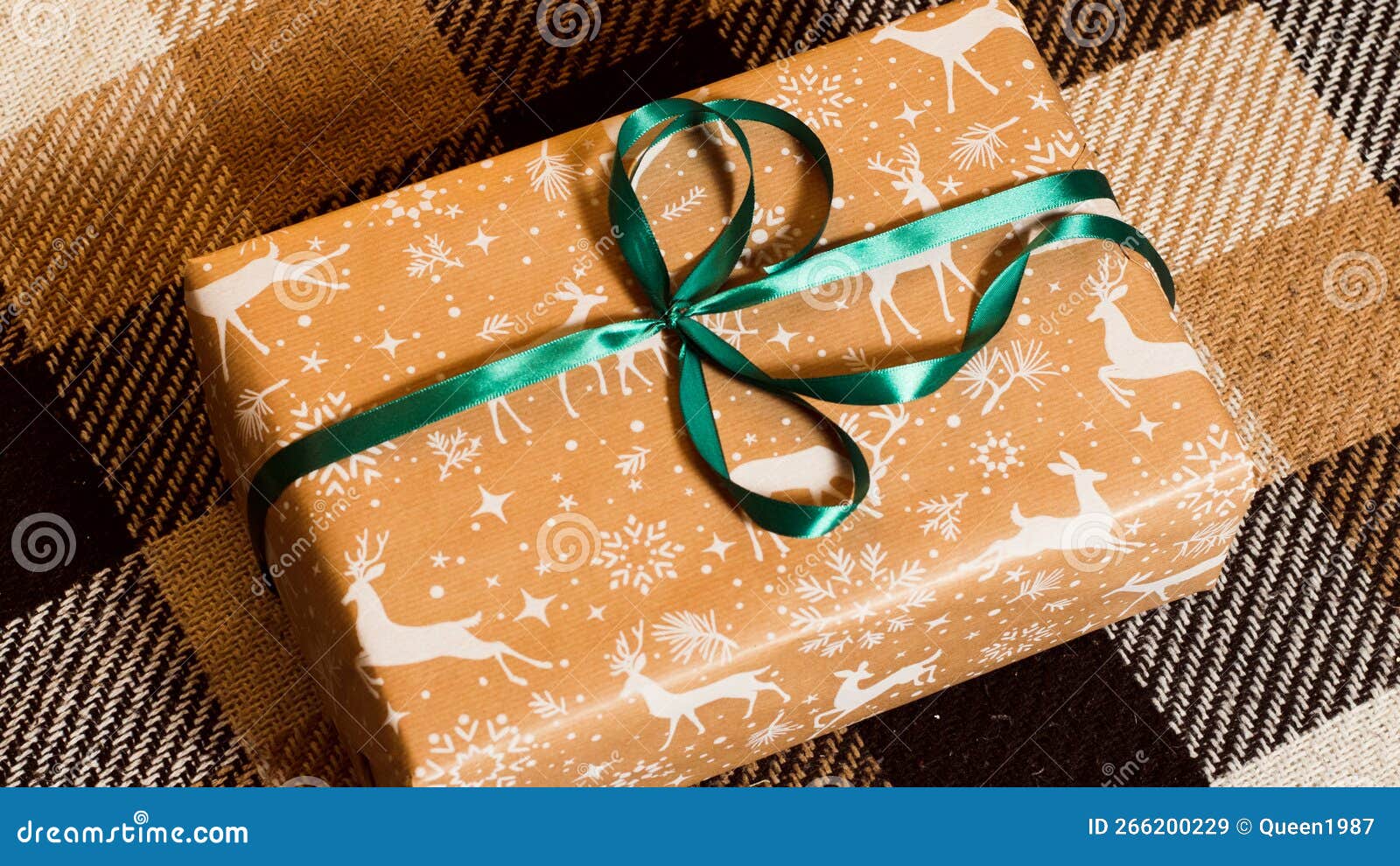 The Gift is Packed in a Beautiful Box on a Brown Blanket Stock Image