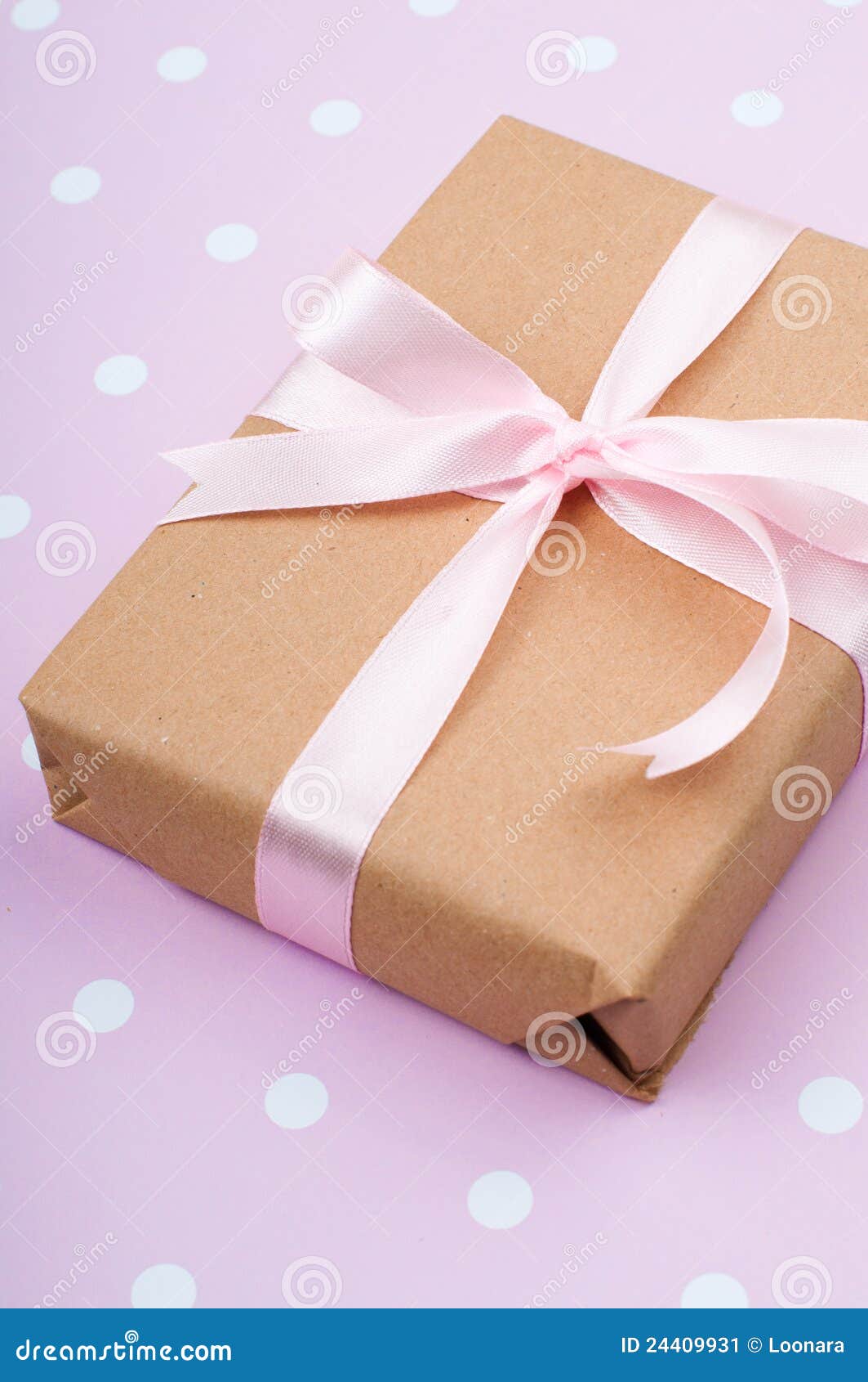 Gift tied with a ribbon stock image. Image of brown, present 24409931