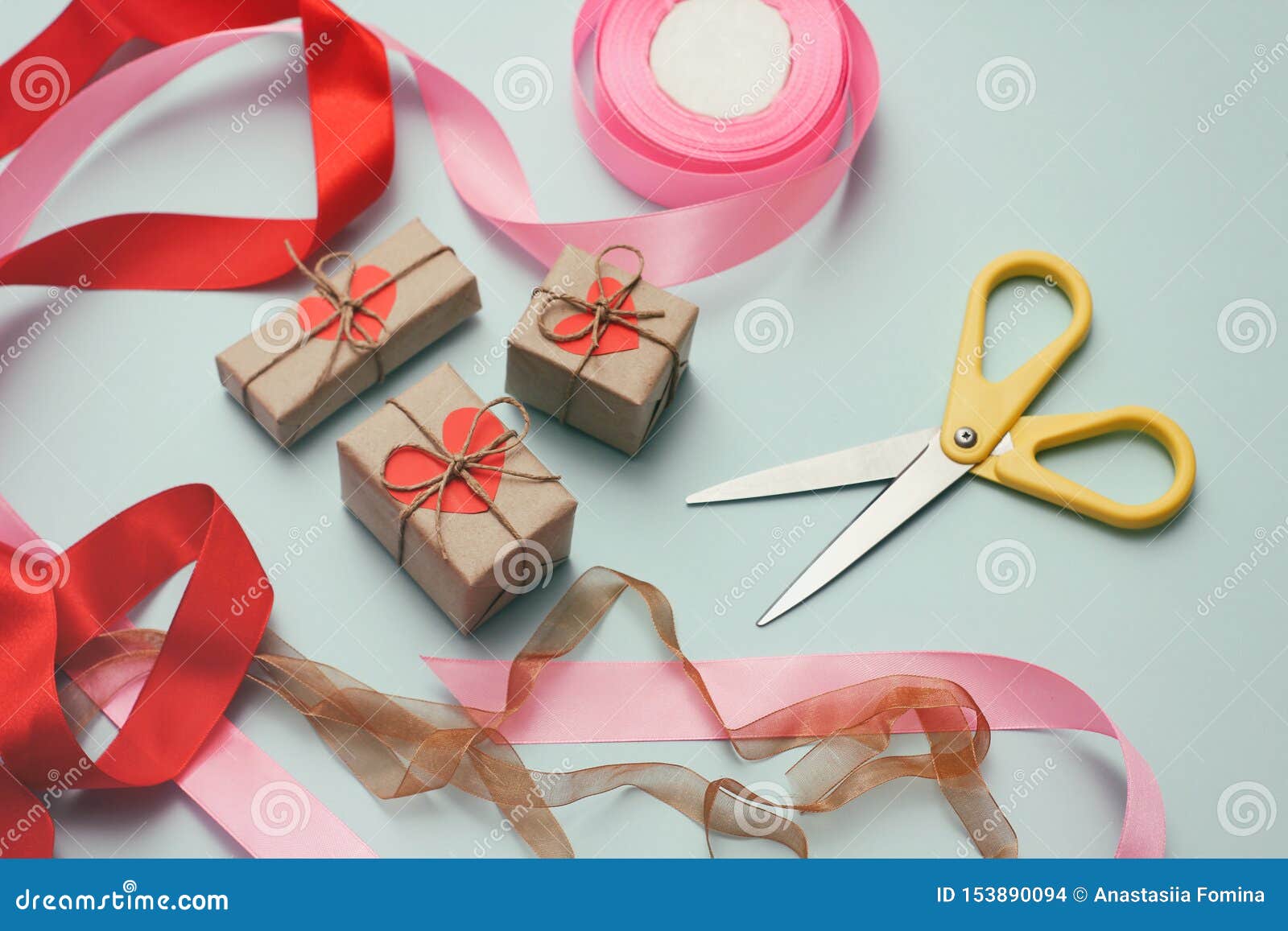 Gift wrapping, boxes, paper, ribbon and scissors on color background.  Materials and accessories for wrapping presents. Close up Stock Photo -  Alamy