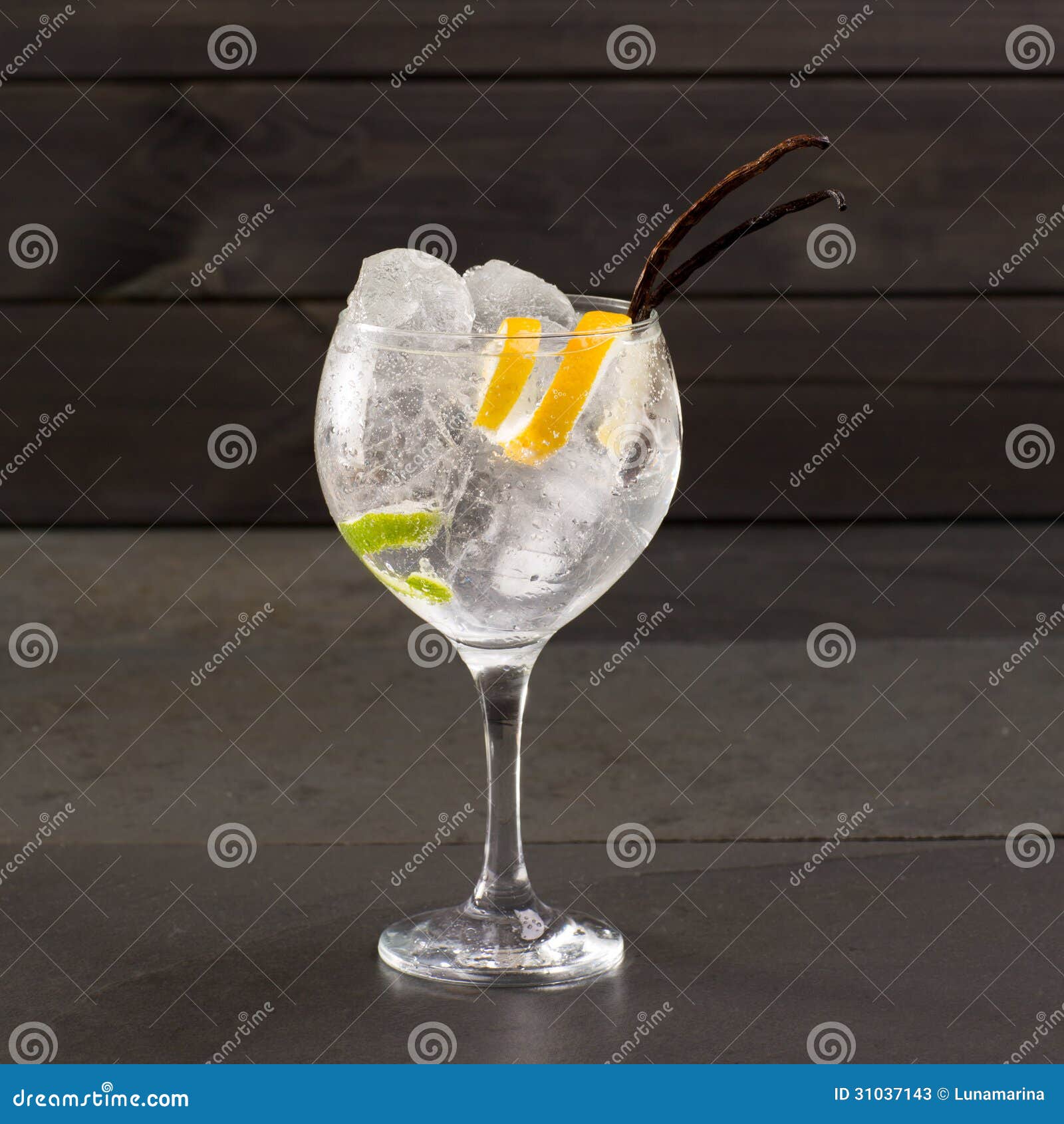 Gin Tonic Cocktail with Ice Vanilla Lima and Lemon on Black Stock Image