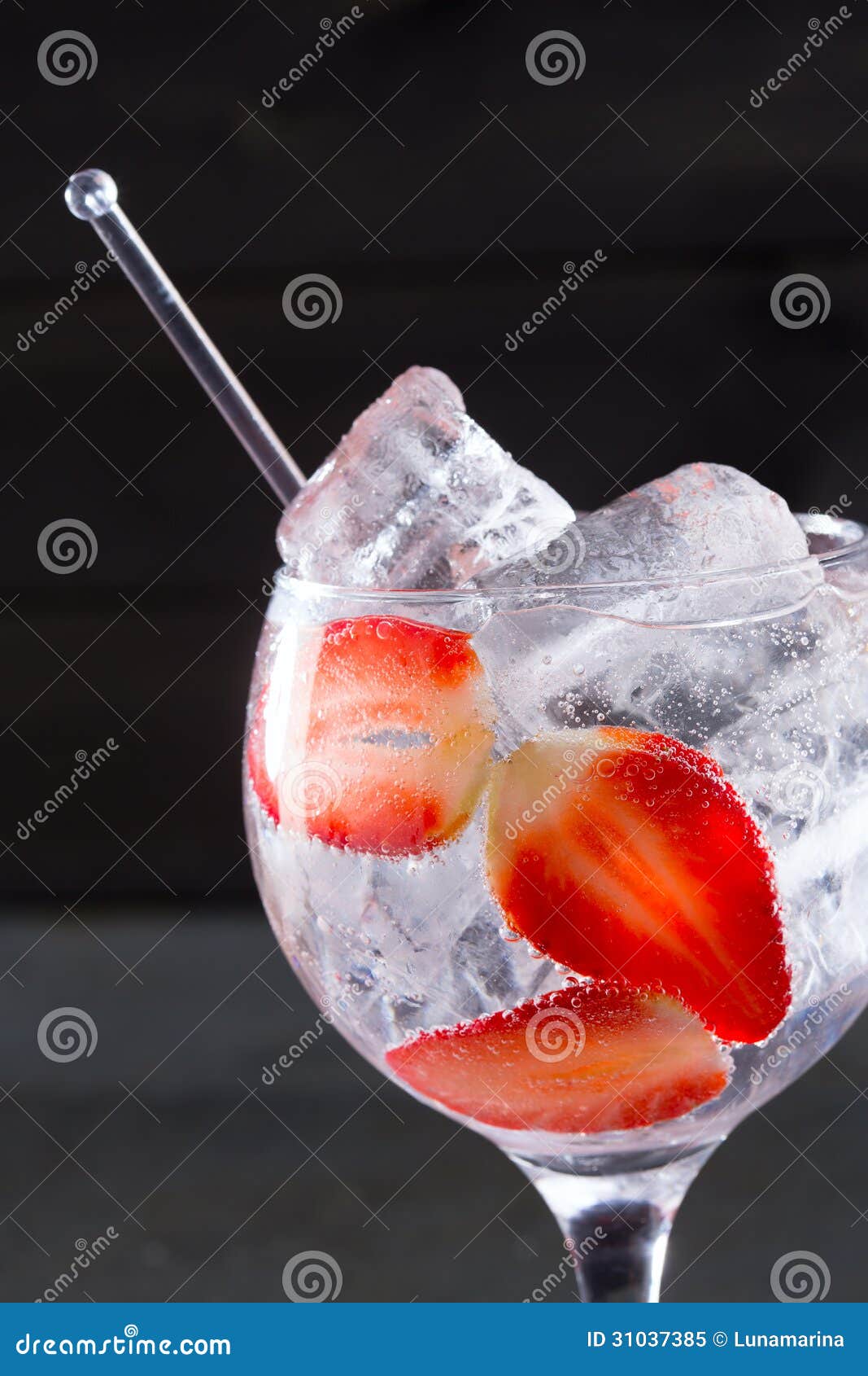 Gin Tonic Cocktail with Strawberries Ice Macro Closeup Stock Image