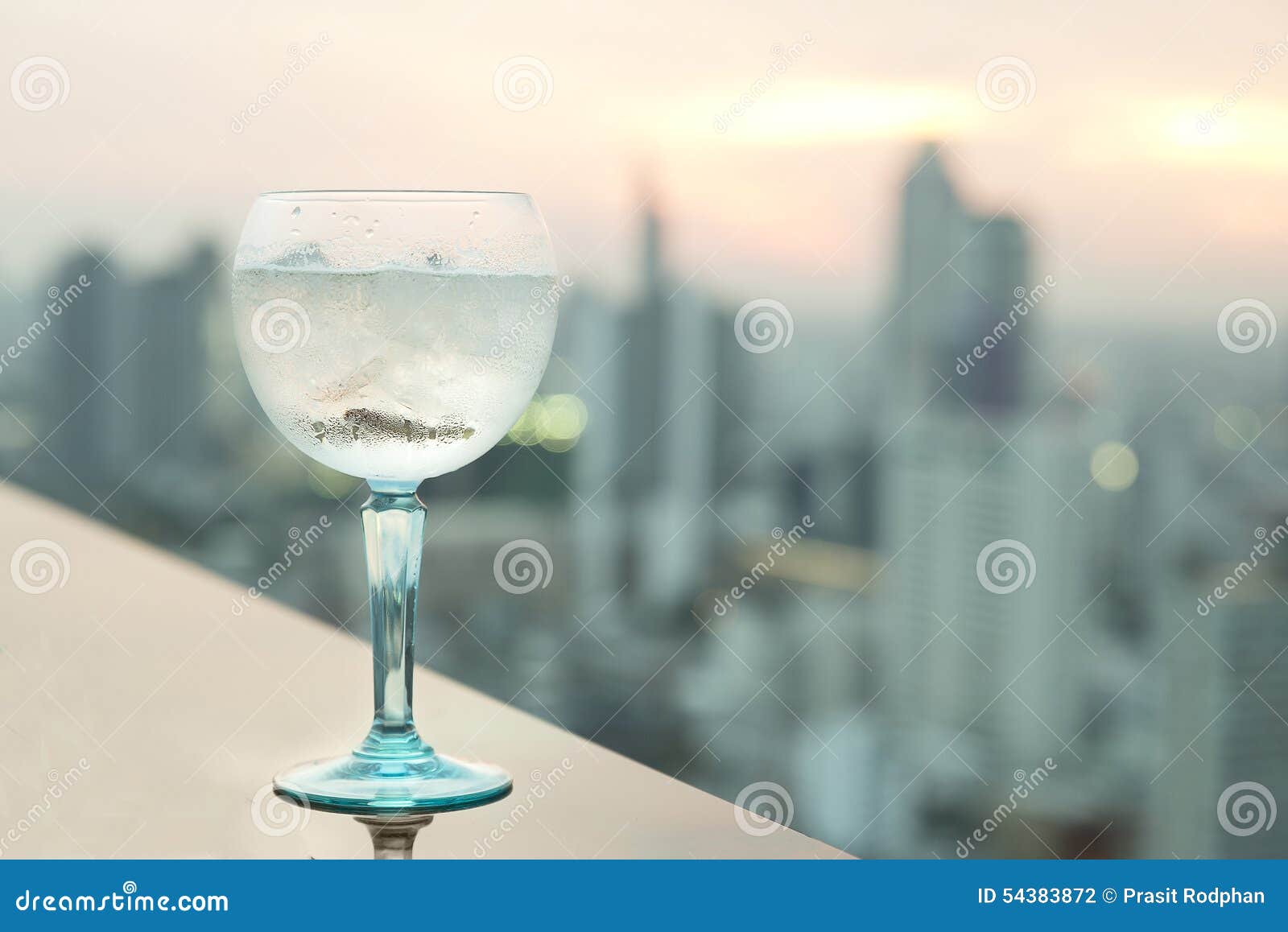 gin tonic cocktail on table in rooftop bar