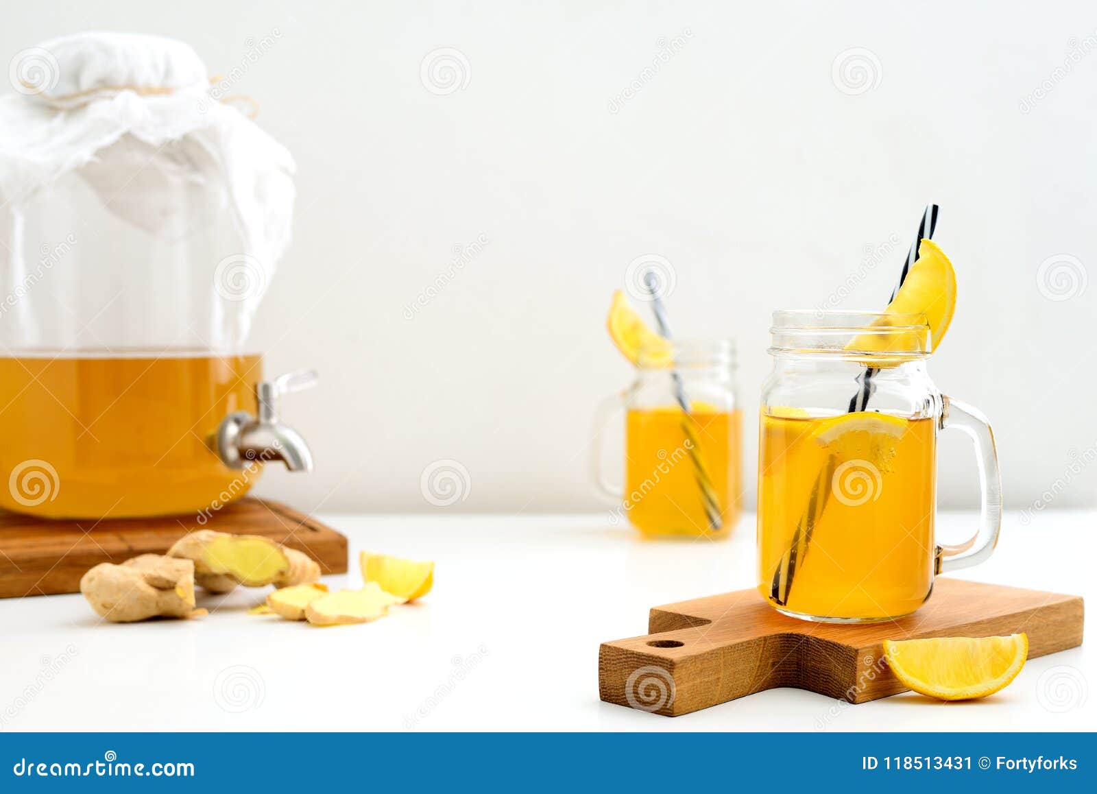 ginger and lemon combucha detox drink in two jars