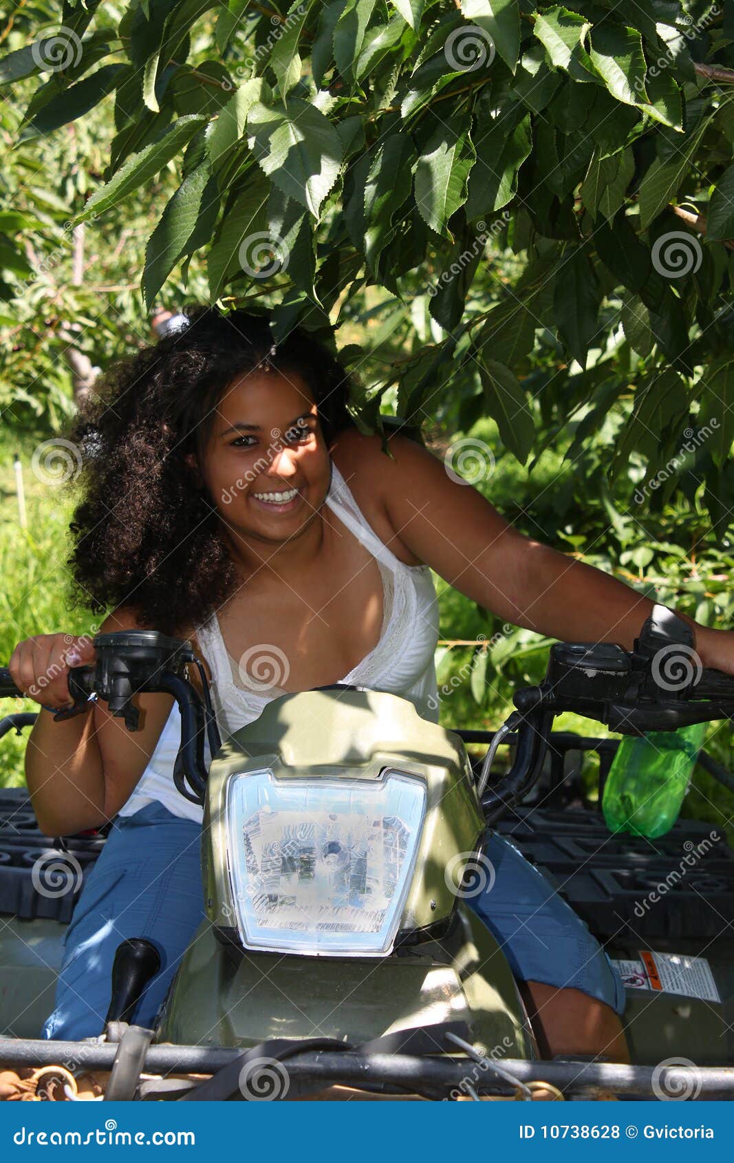 Girl on 4 wheeler stock photo. Image of canada, smile 10738628