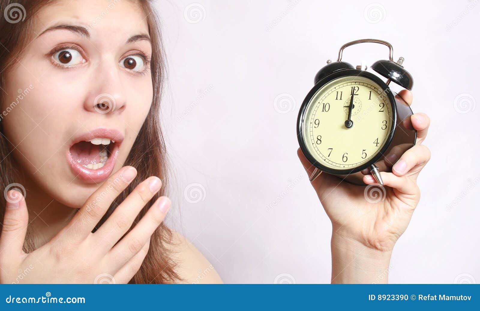 The Girl And An Alarm Clock. Picture Image 8923390