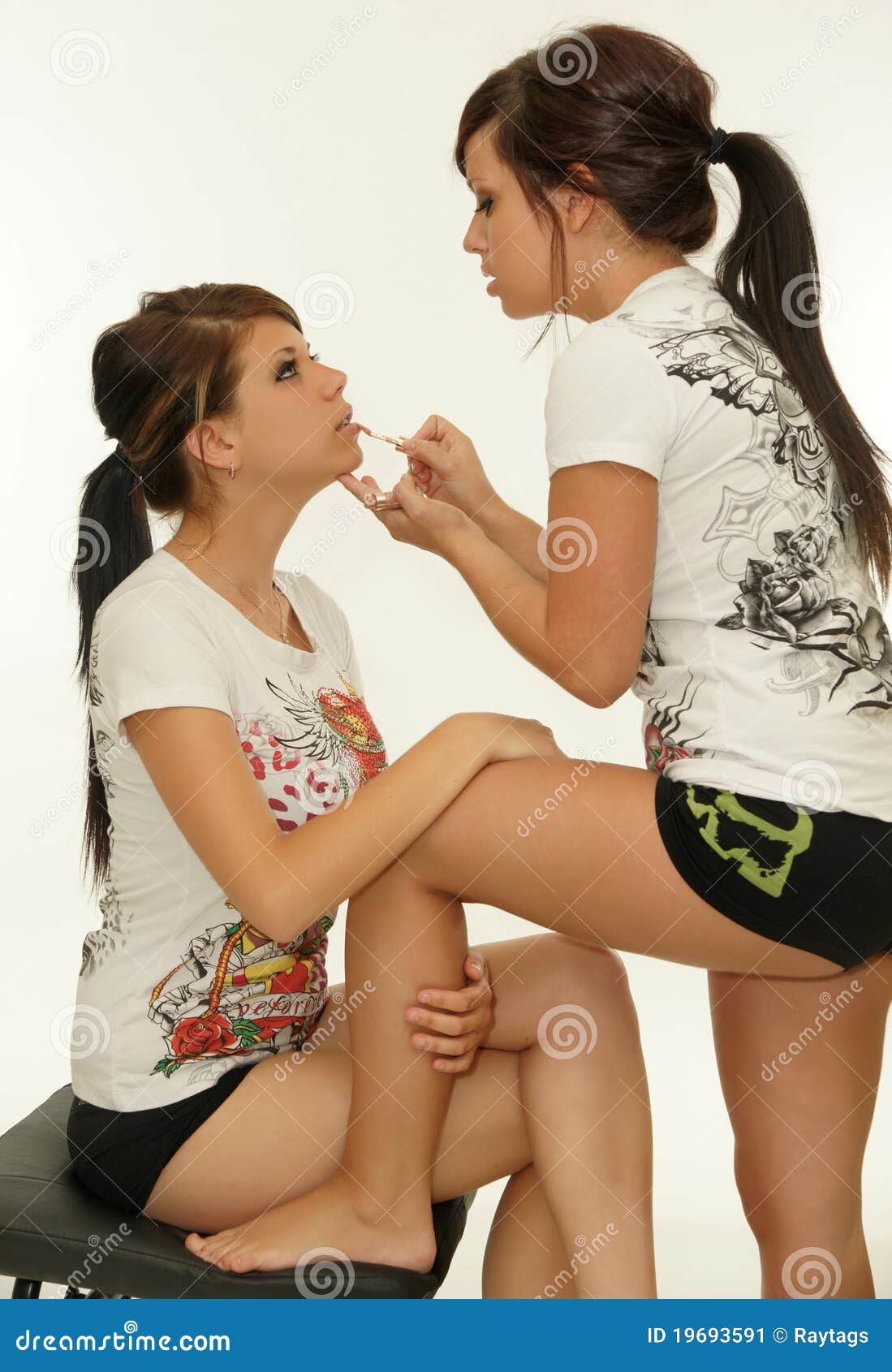 Girl applying lip gloss stock image. Image of hair, isolated 19693591