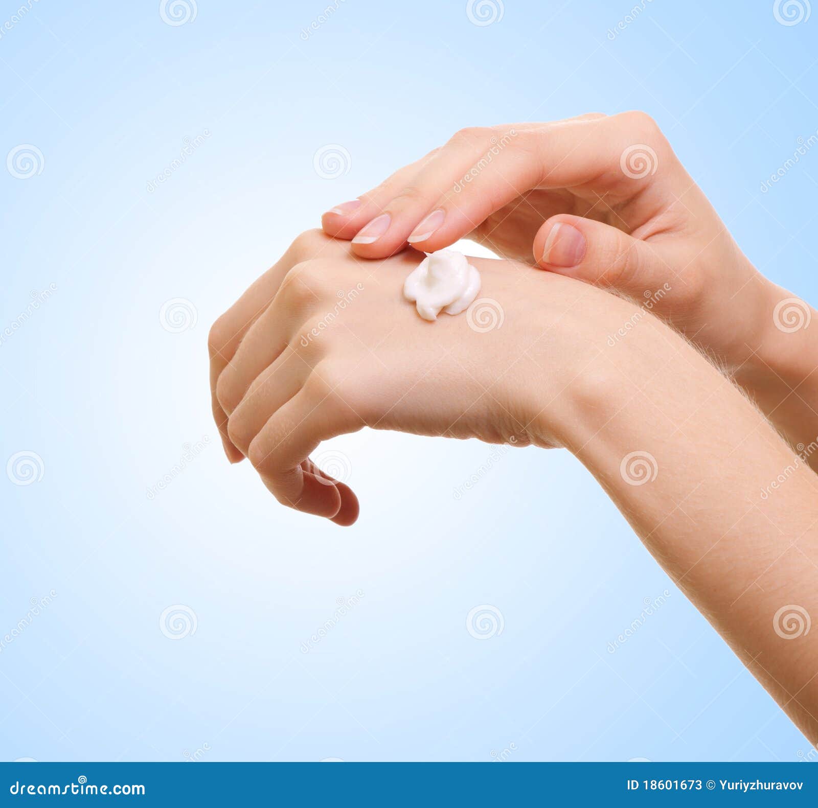 girl applying some white lotion on her hand
