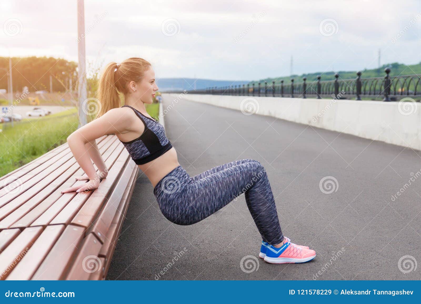 Girl Athlete Doing Sports Exercises Workout on the Waterfront Stock ...