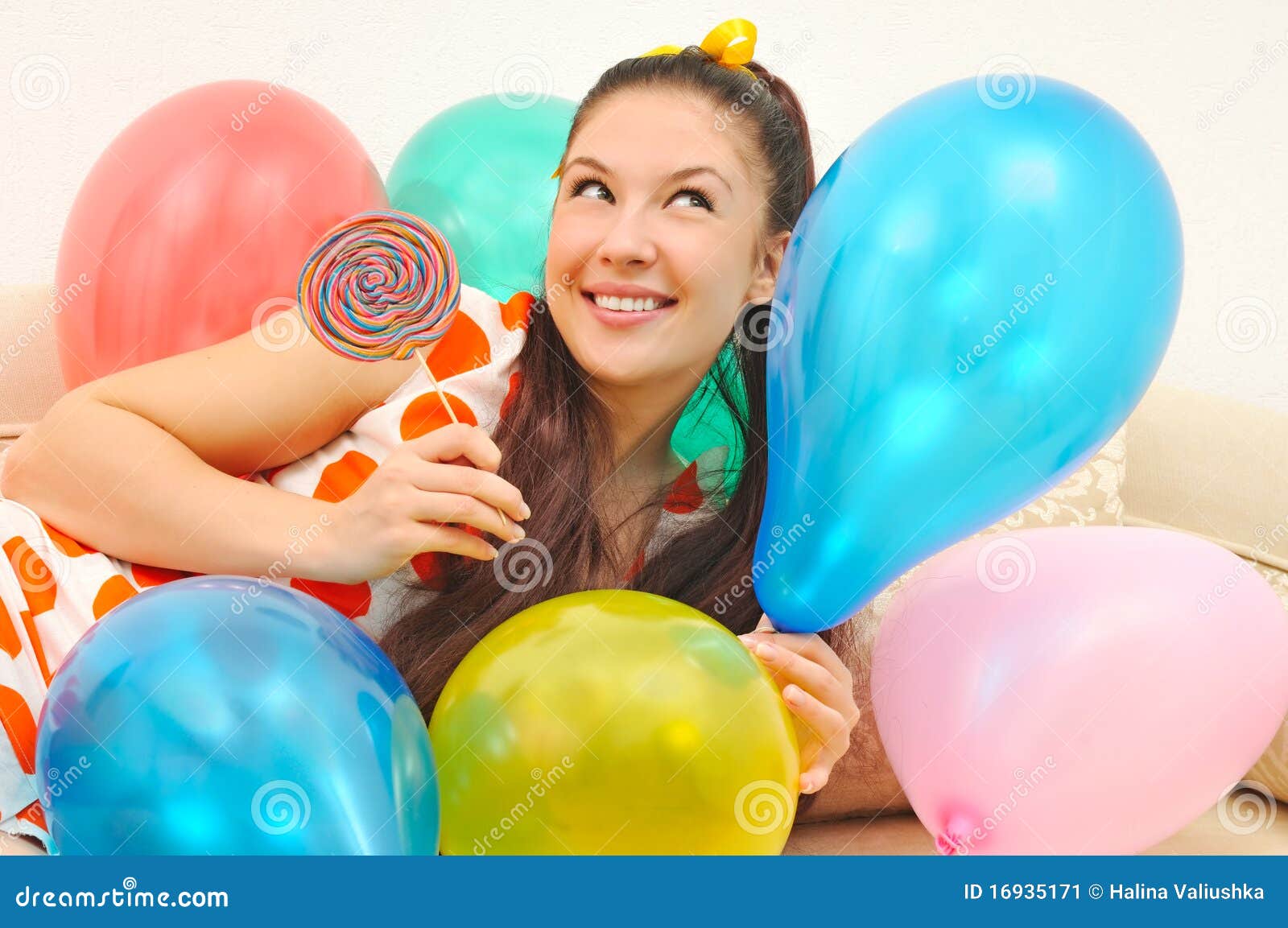 girl with balloons and bonbon