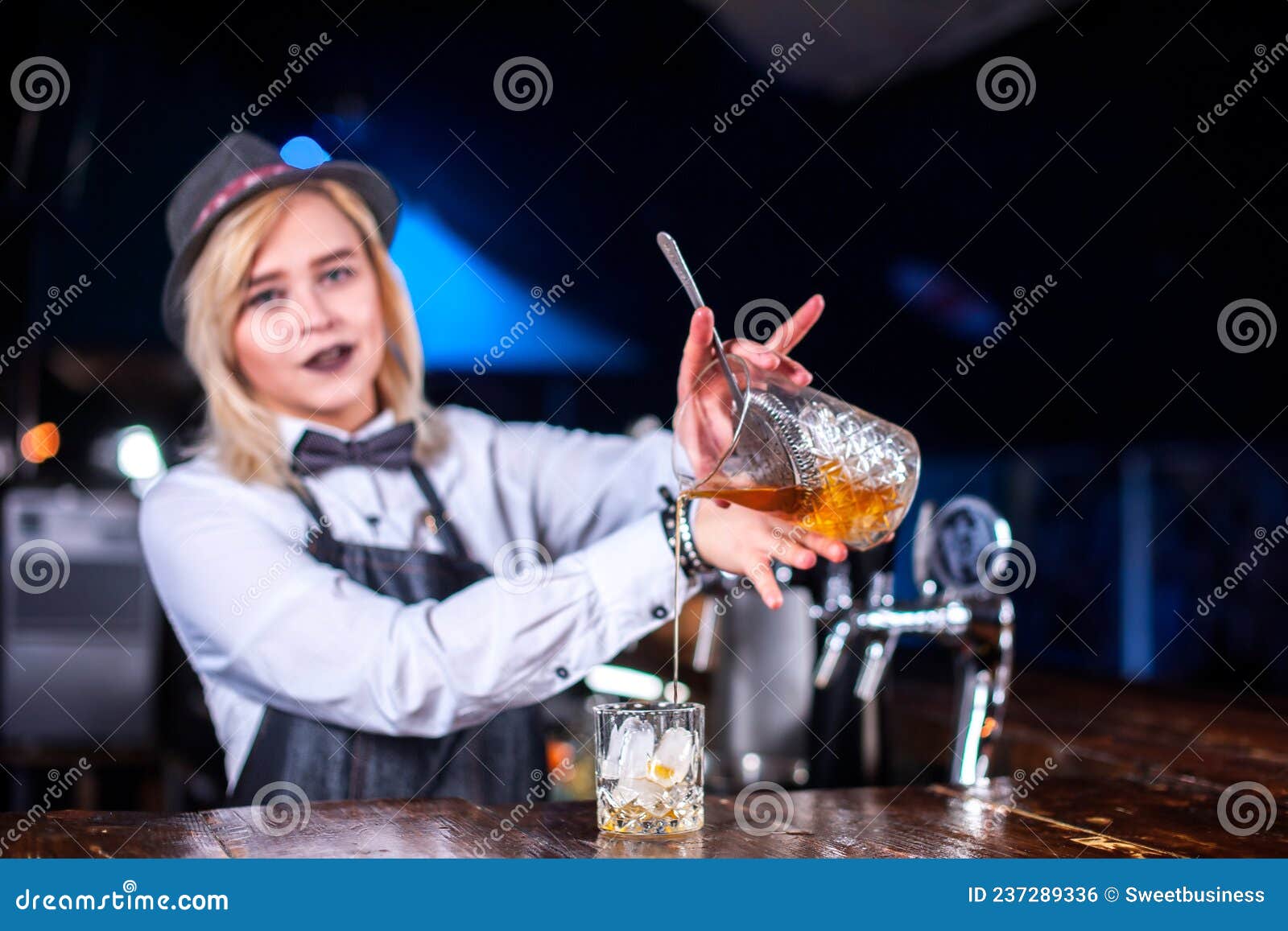 Girl Barman Concocts a Cocktail in the Saloon Stock Photo - Image of ...