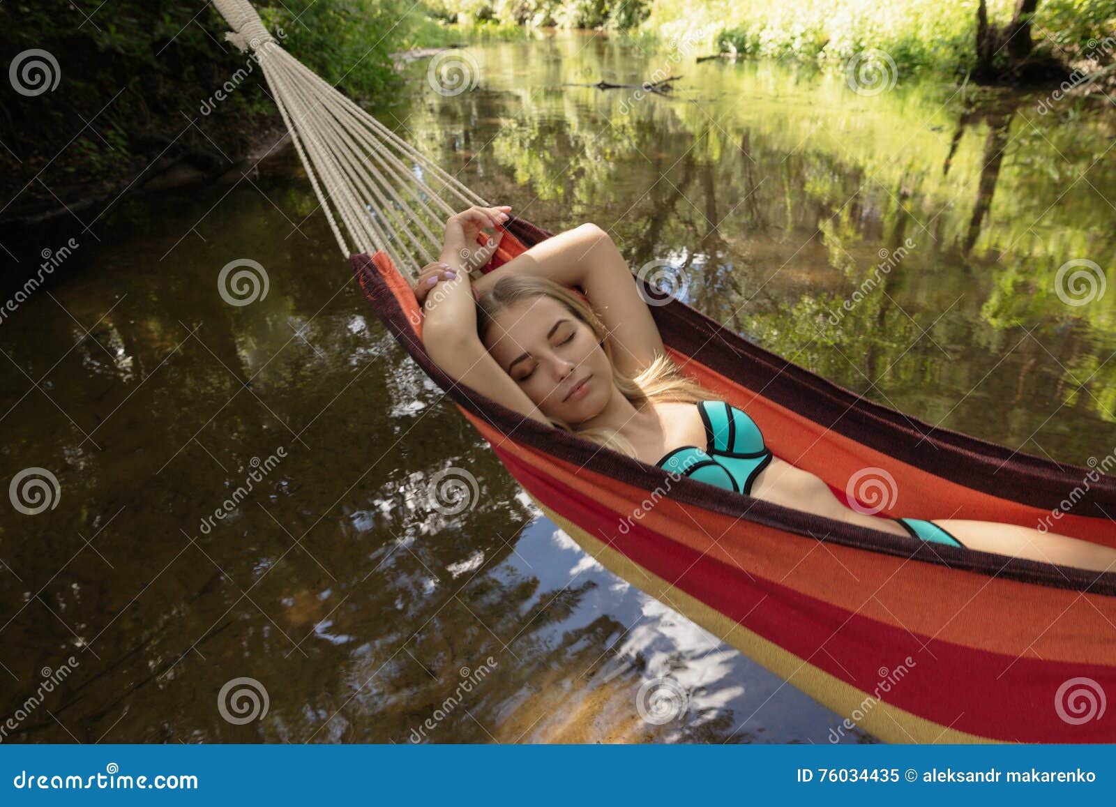 Girl In A Bathing Suit Lying In A Hammock Over The Water Stock Image Image Of Enjoy Ocean 