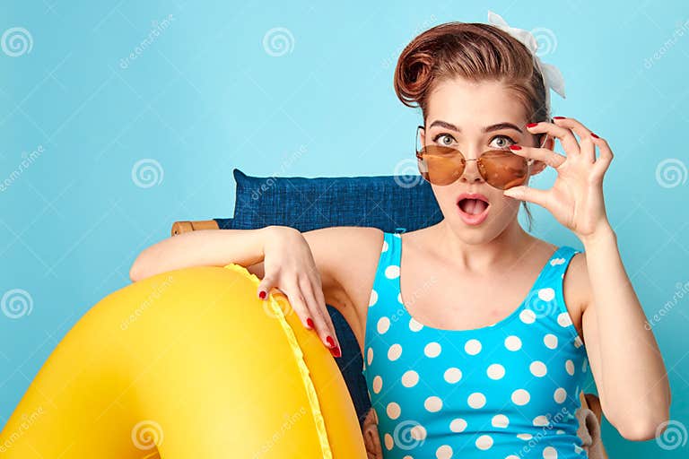 Girl In A Bathing Suit Lying On A Lounger And Holding In Her Arms An Inflatable Circle Stock 