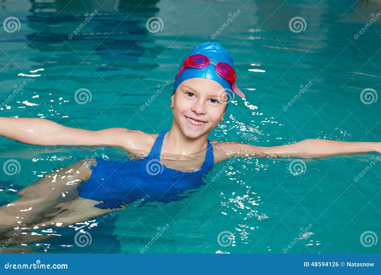 Girl in a Bathing Suit, Swim Cap, Goggles, Holding on Stock Photo ...