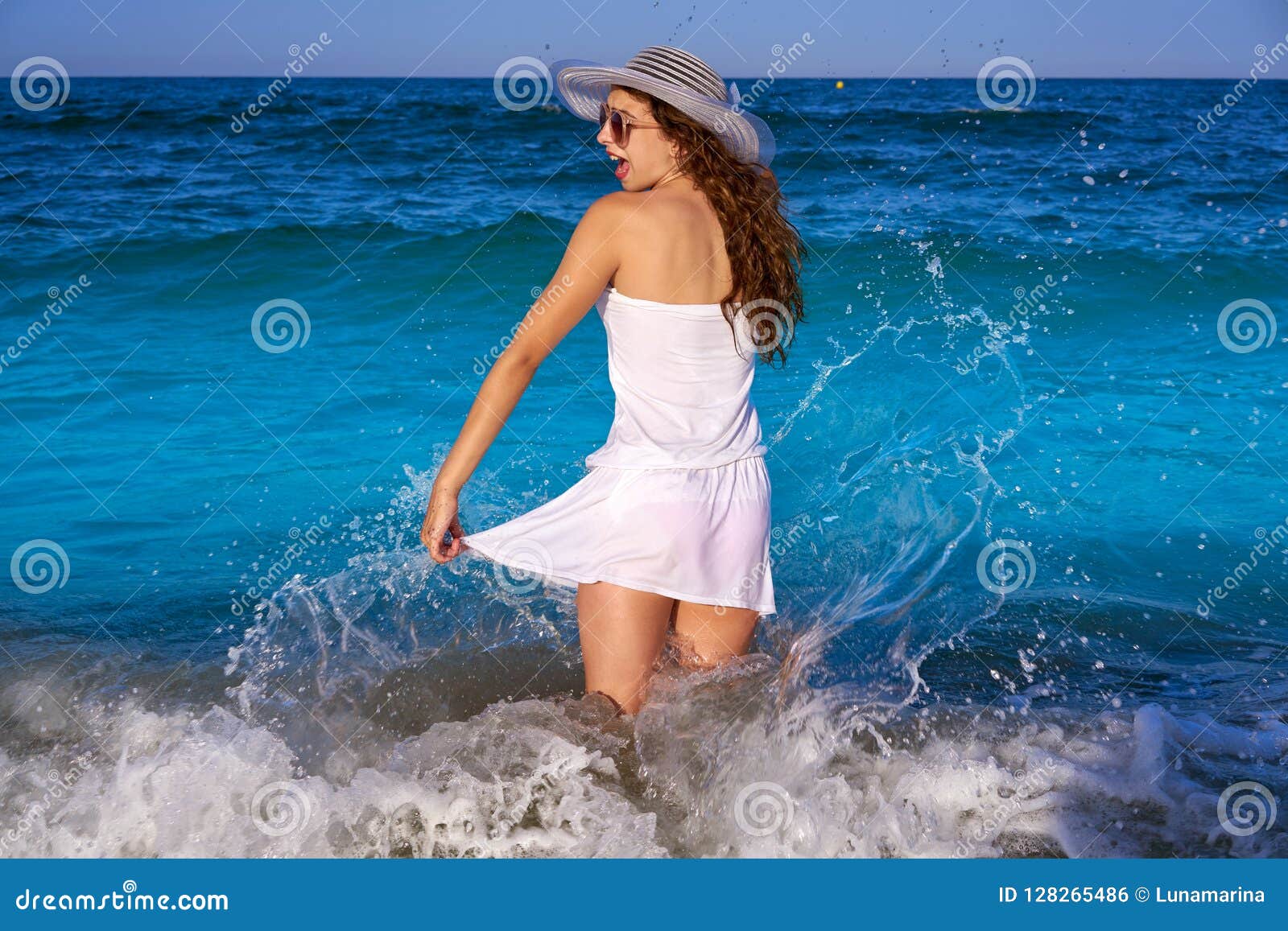 Preteen Girl Carrying A Surfboard To The Ocean Stock Image 