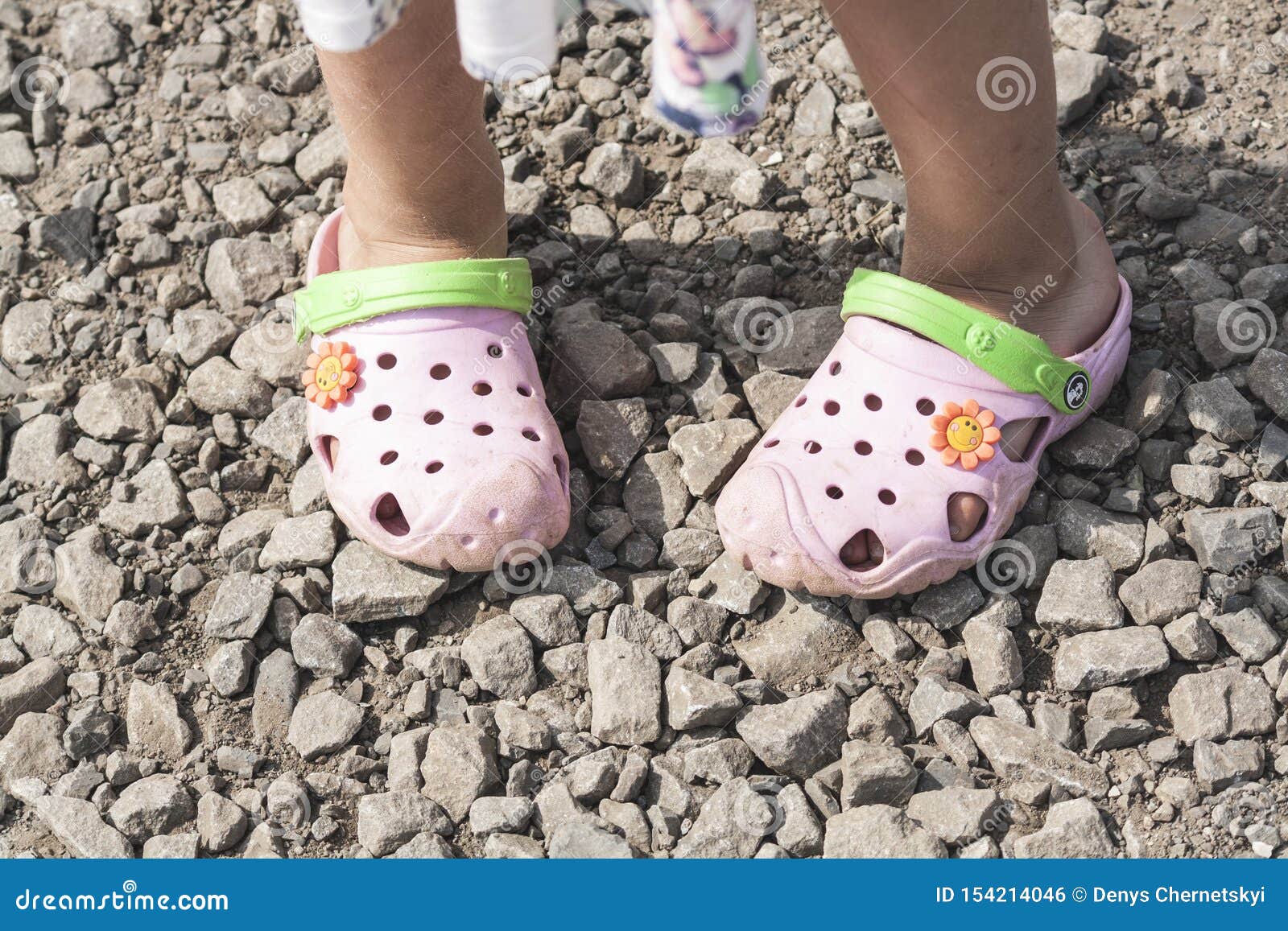 Girl in Beach Slippers Crocs on a Stone Road Stock Photo - Image of ...