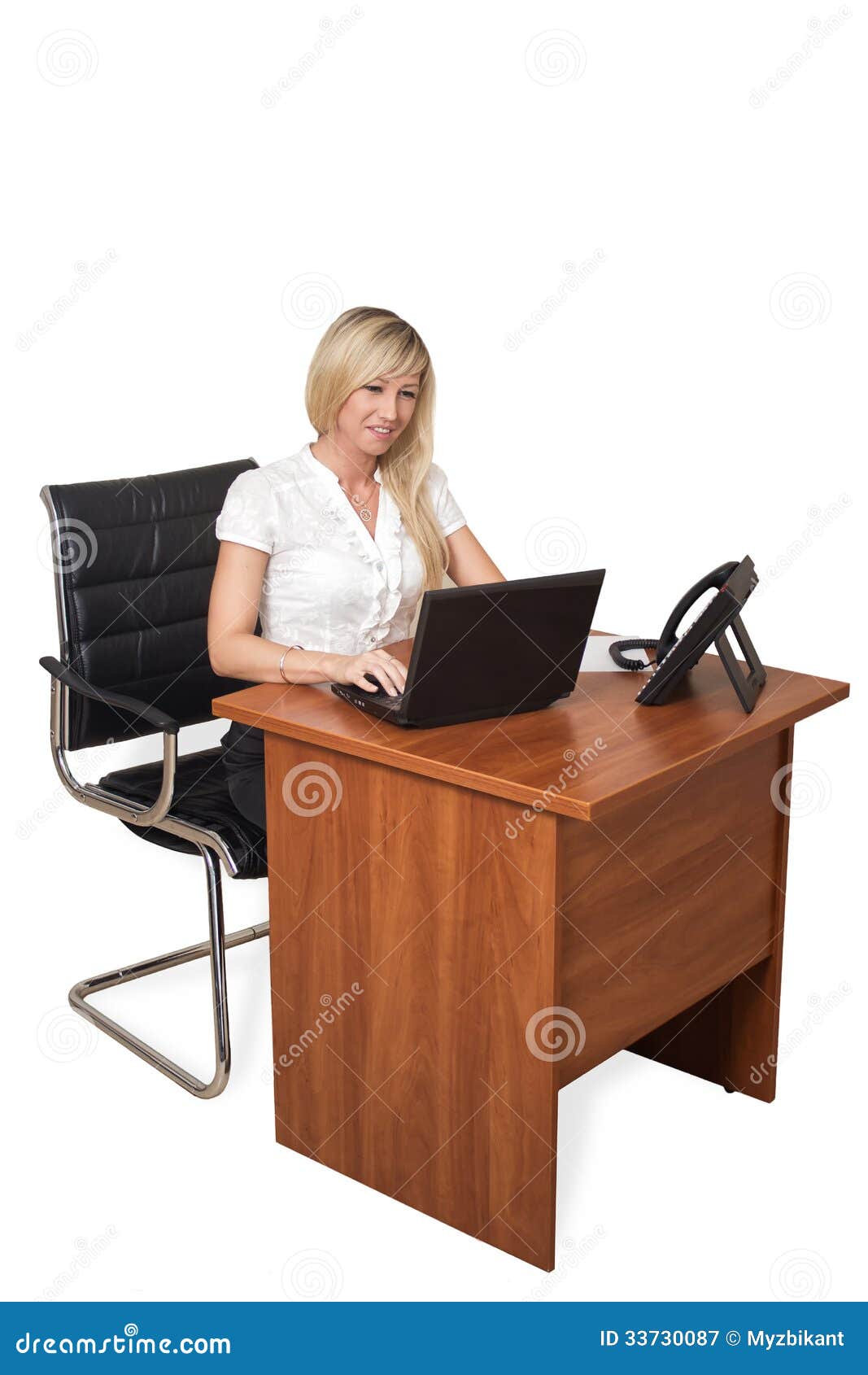 Girl Behind The Desk With A Laptop Royalty Free Stock 