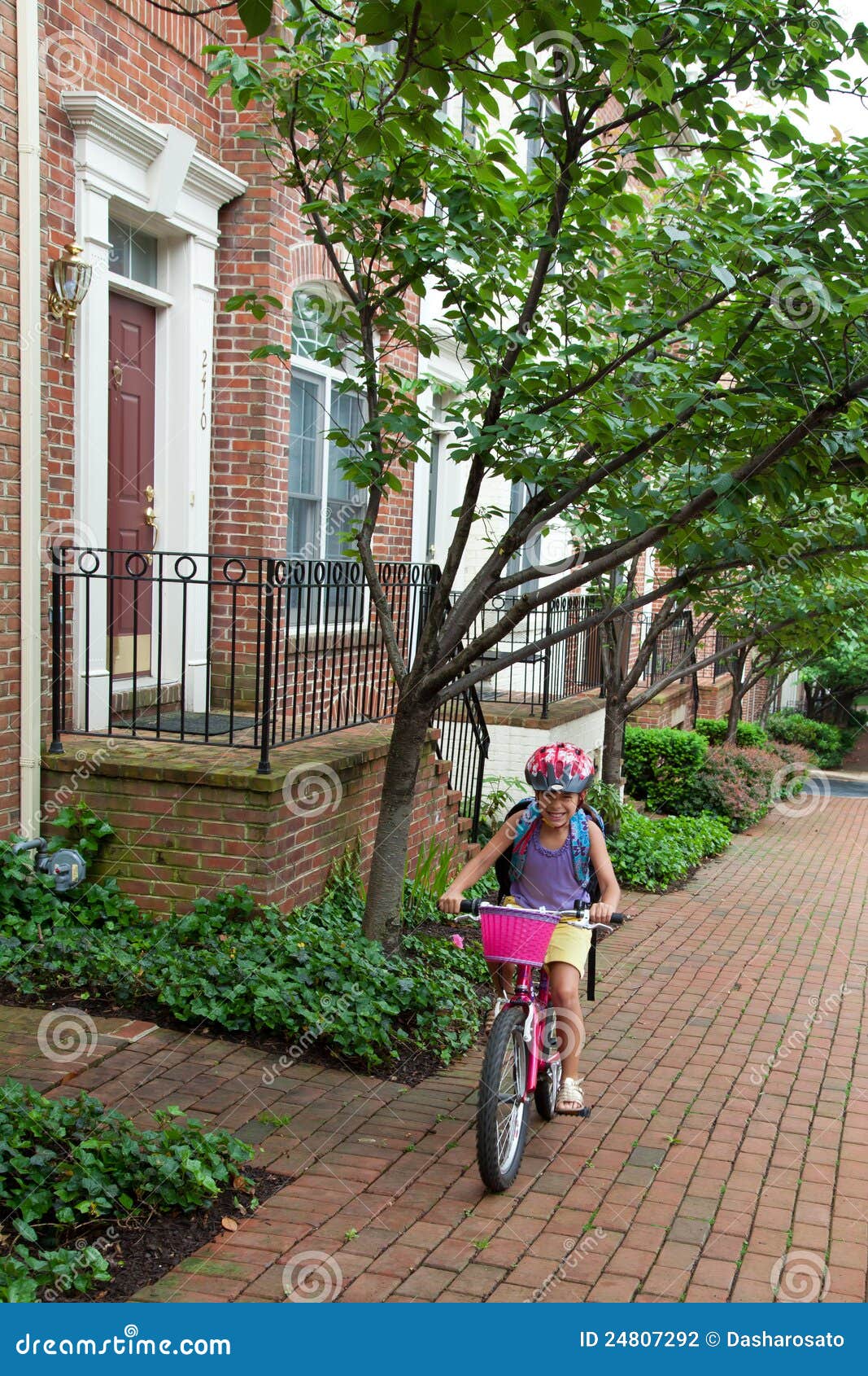 girl biking to school