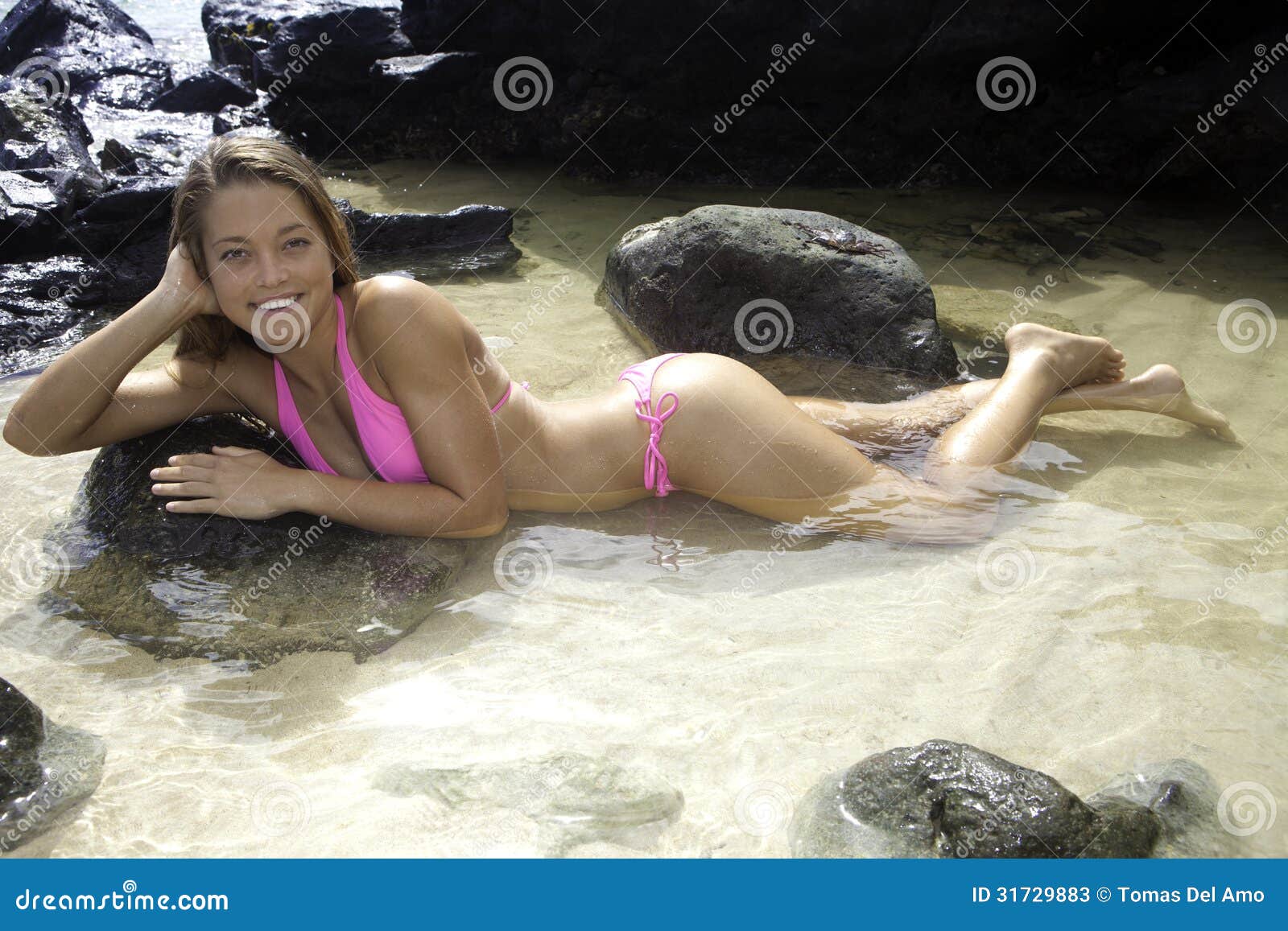 girl in bikini in a tide pool