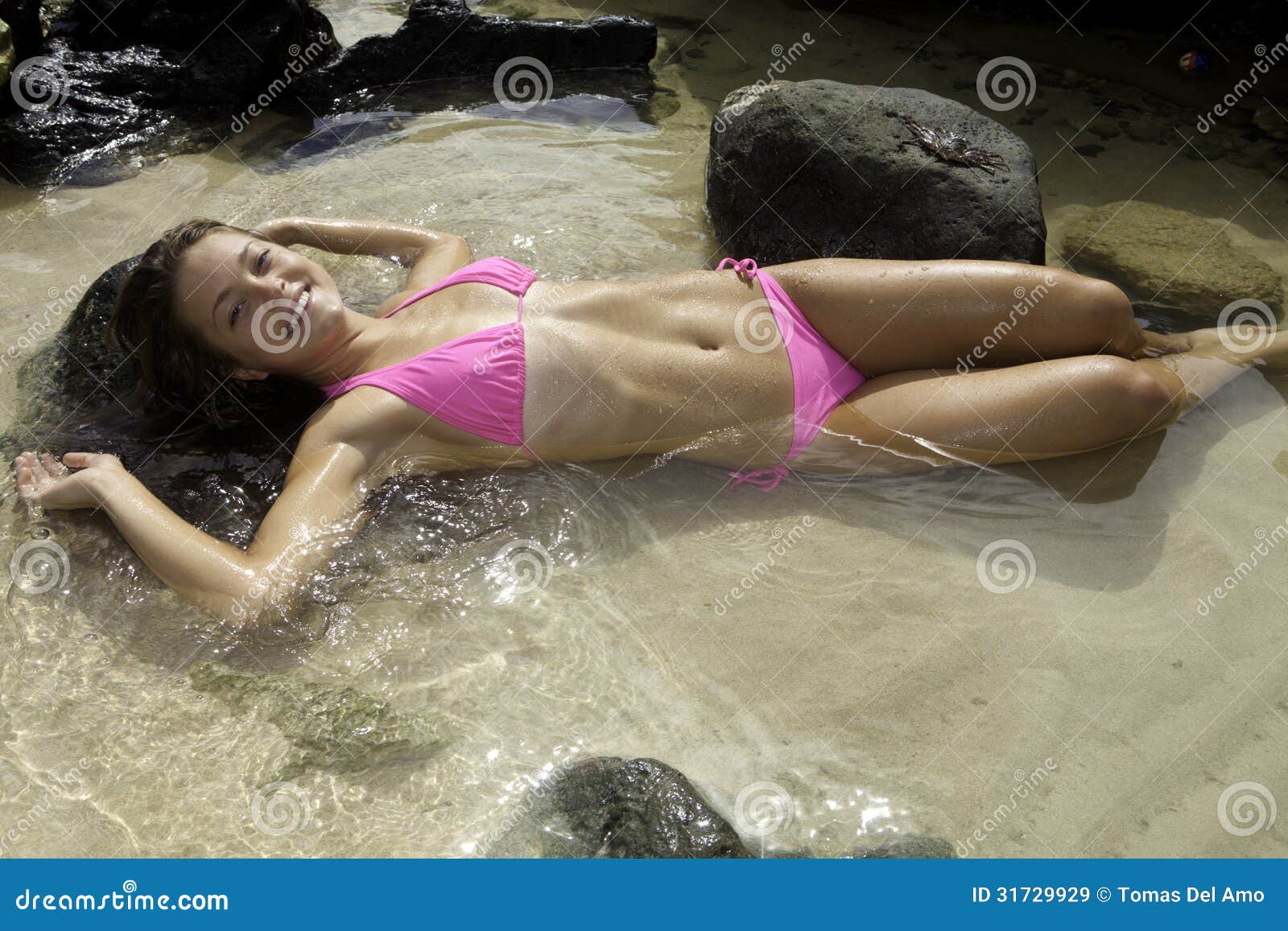 girl in bikini in a tide pool