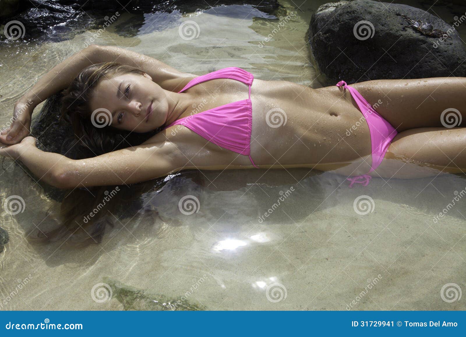 girl in bikini in a tide pool