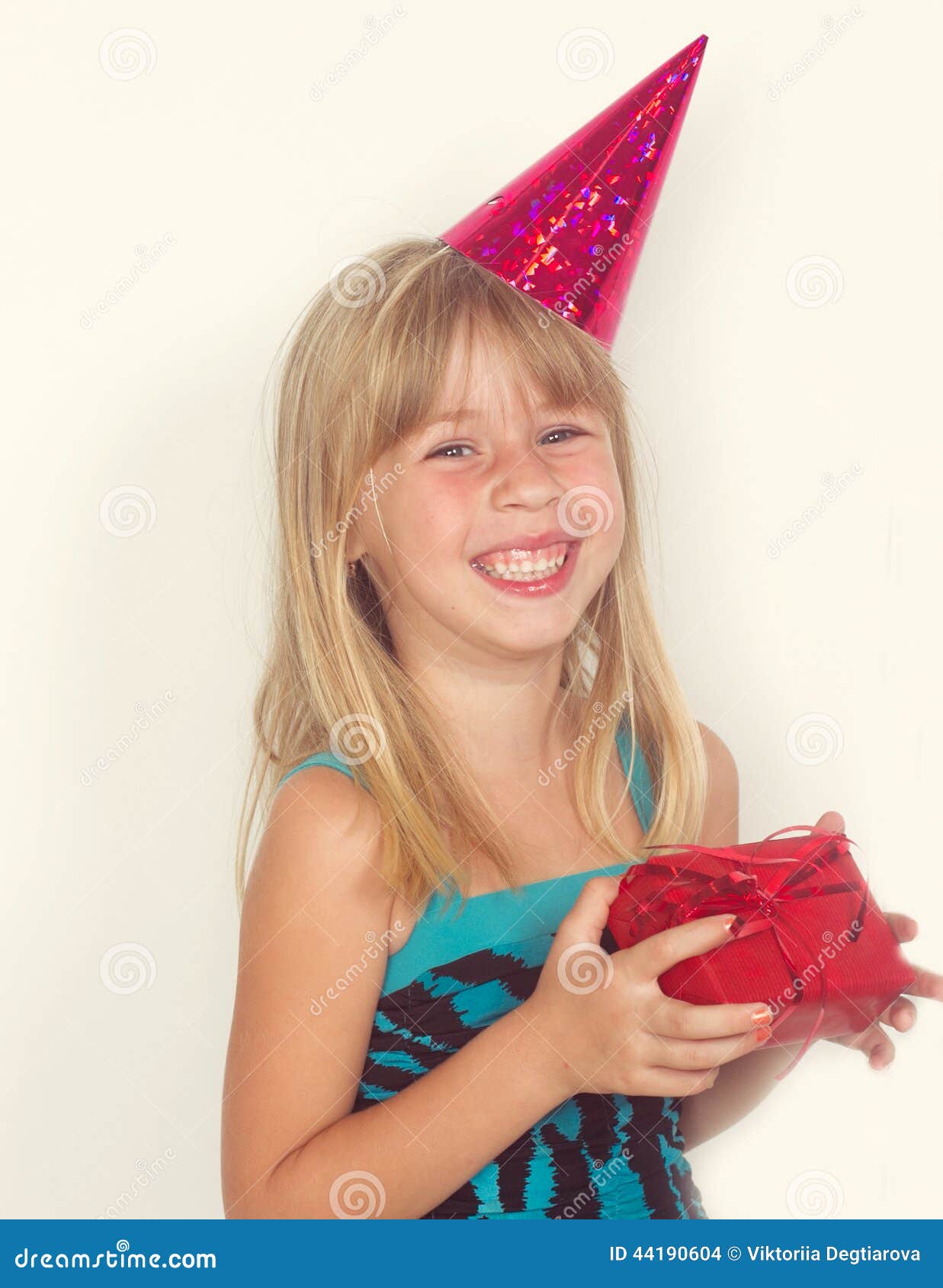 Girl with a Birthday Gift and Cap Stock Photo Image of positive