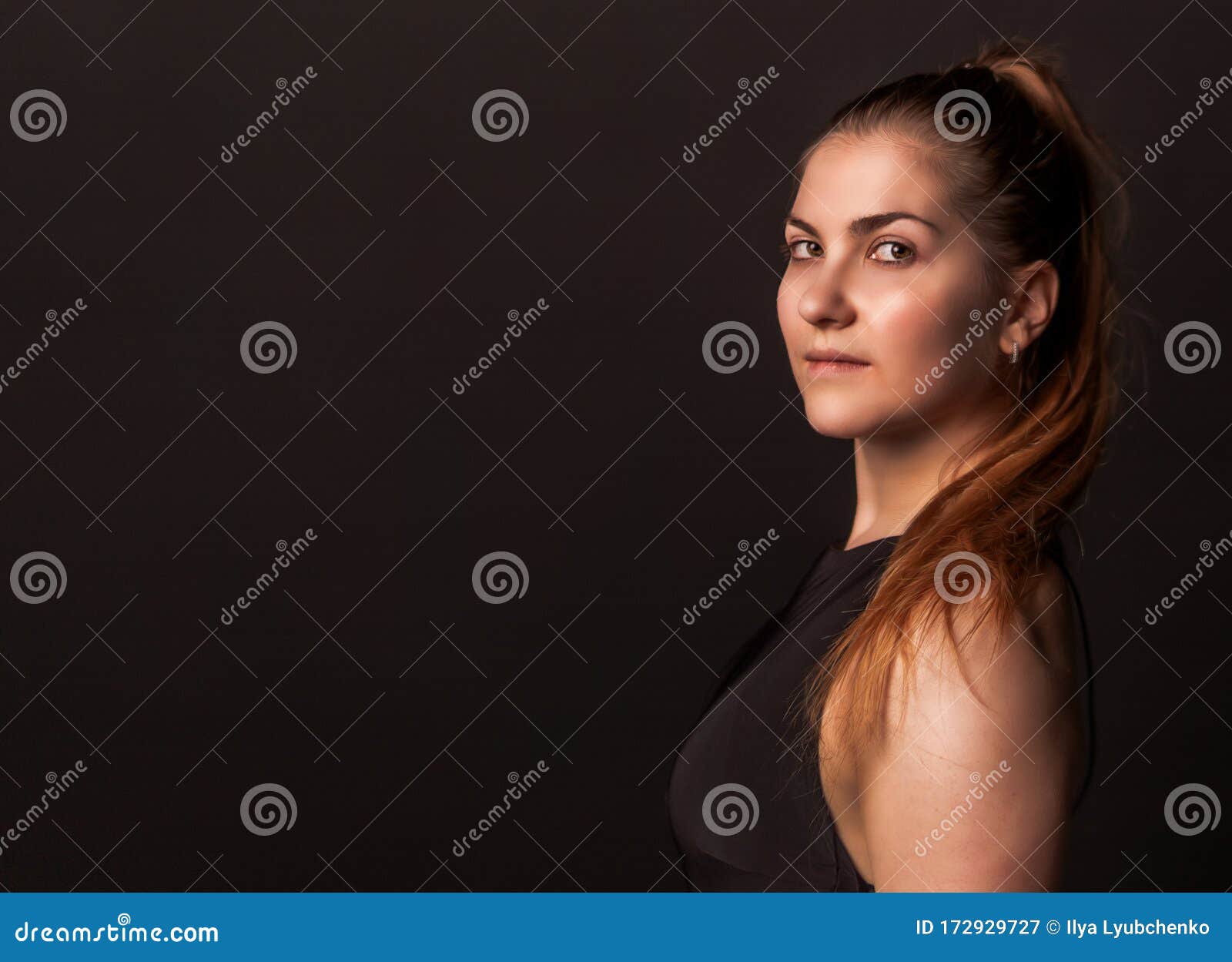 Girl on a Black Background with a Brown Hair Looks at Sex Trafficking Beautiful Stock Image