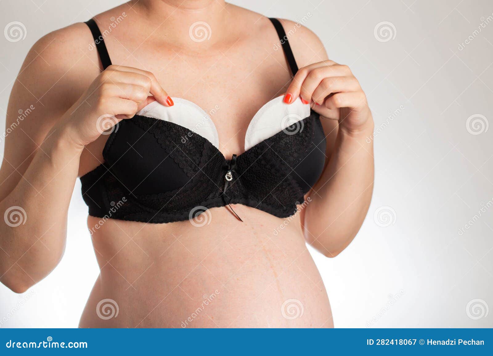A Girl in a Black Bra Puts Pads from the Flow of Milk in Her Bra. Soft,  Hypoallergenic Breast Pads. Stock Image - Image of female, childbearing:  282418067
